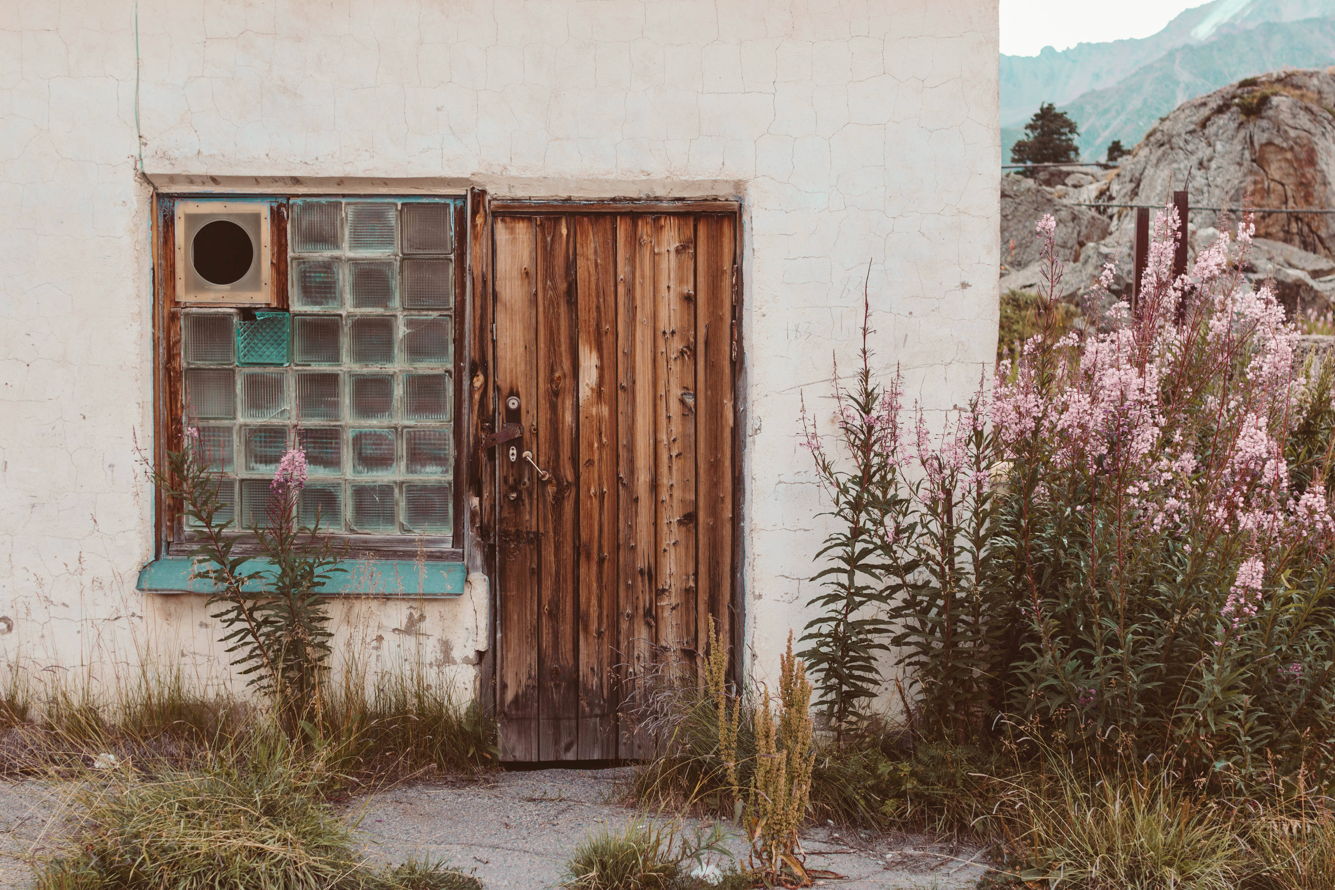 typical house in kazakhstan, weathered wooden door, glass-block window, 5K Desktop Wallpaper