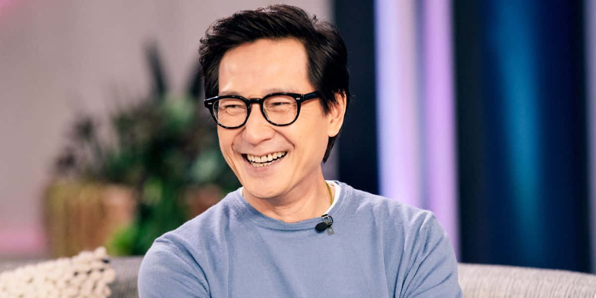 Ke Huy Quan, glasses, blue sweater, SD Desktop Wallpaper
