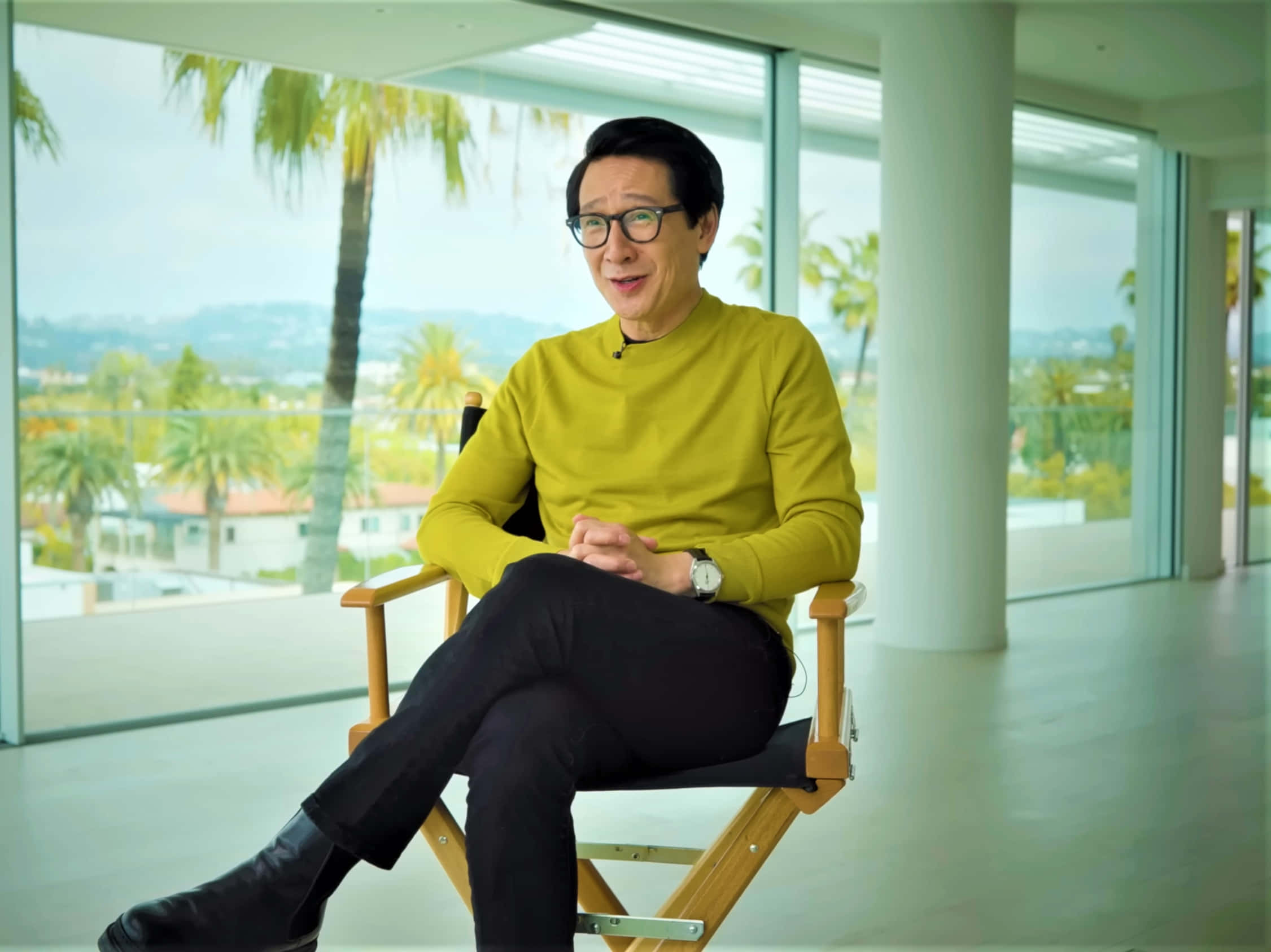 Ke Huy Quan, yellow sweater, director's chair, Full HD Desktop Wallpaper