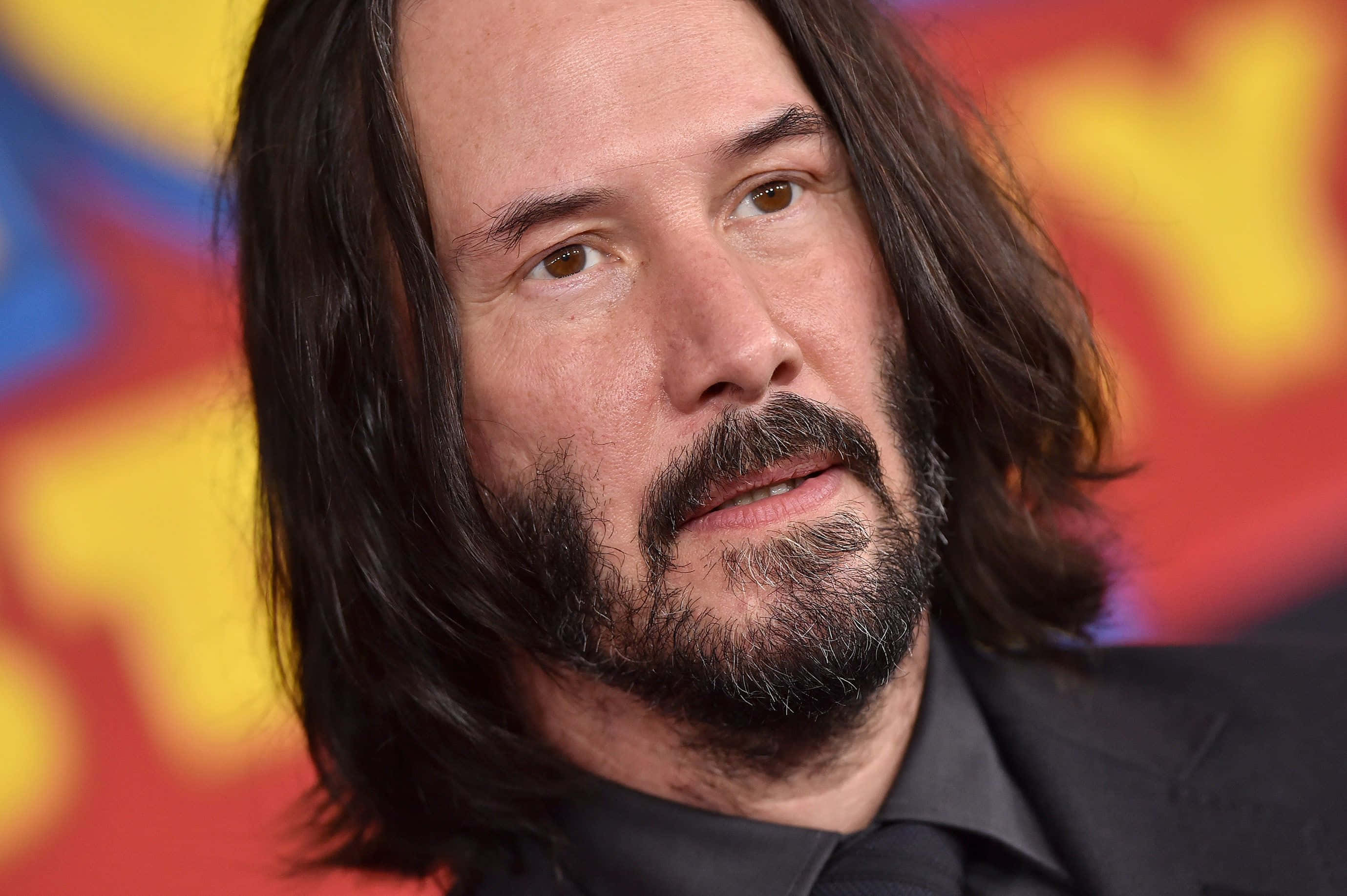 Keanu Reeves, classic leather jacket, long dark hair, 2K Desktop Wallpaper