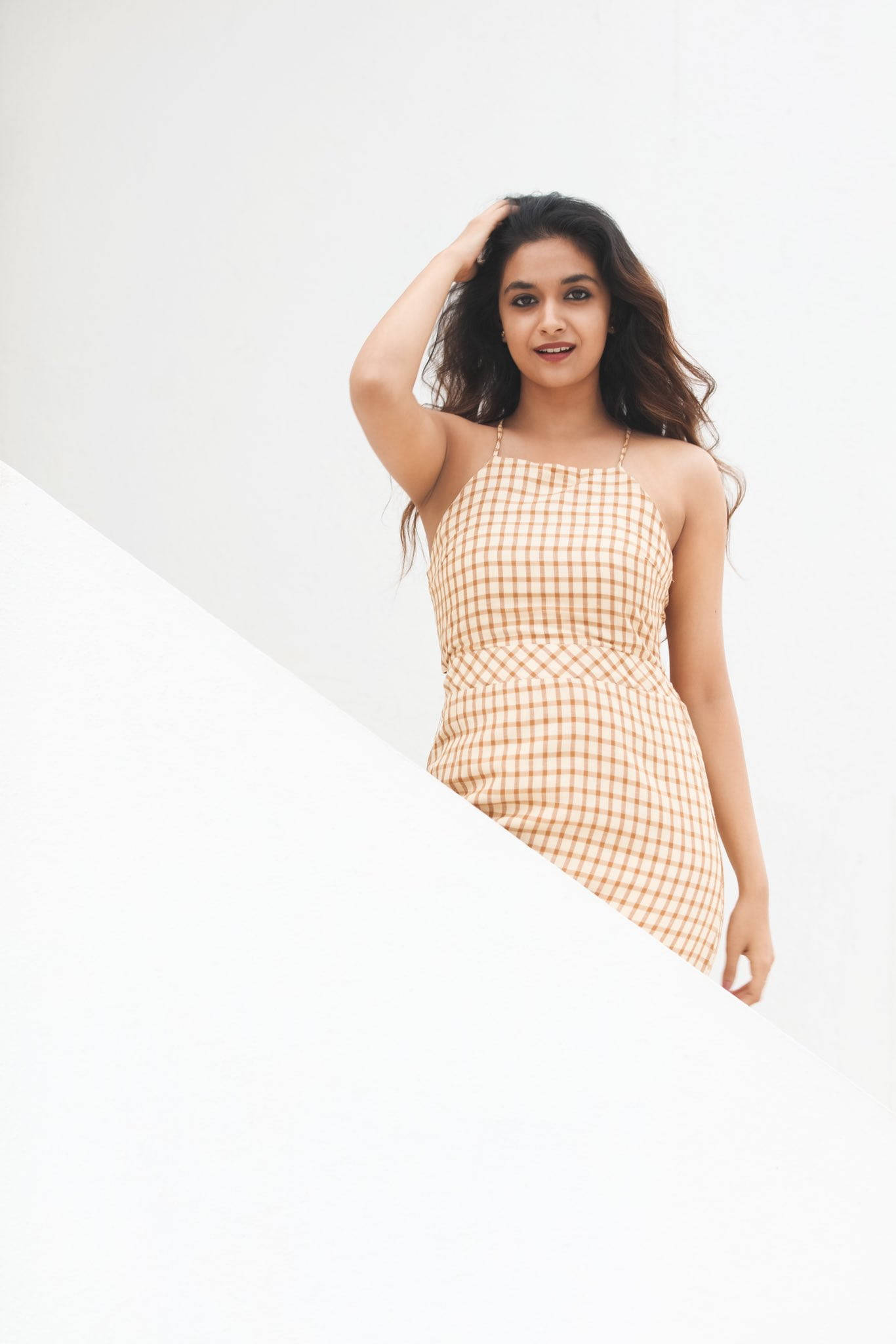 Keerthi Suresh, beige and white checkered dress, stark white diagonal wall, Full HD Phone Wallpaper