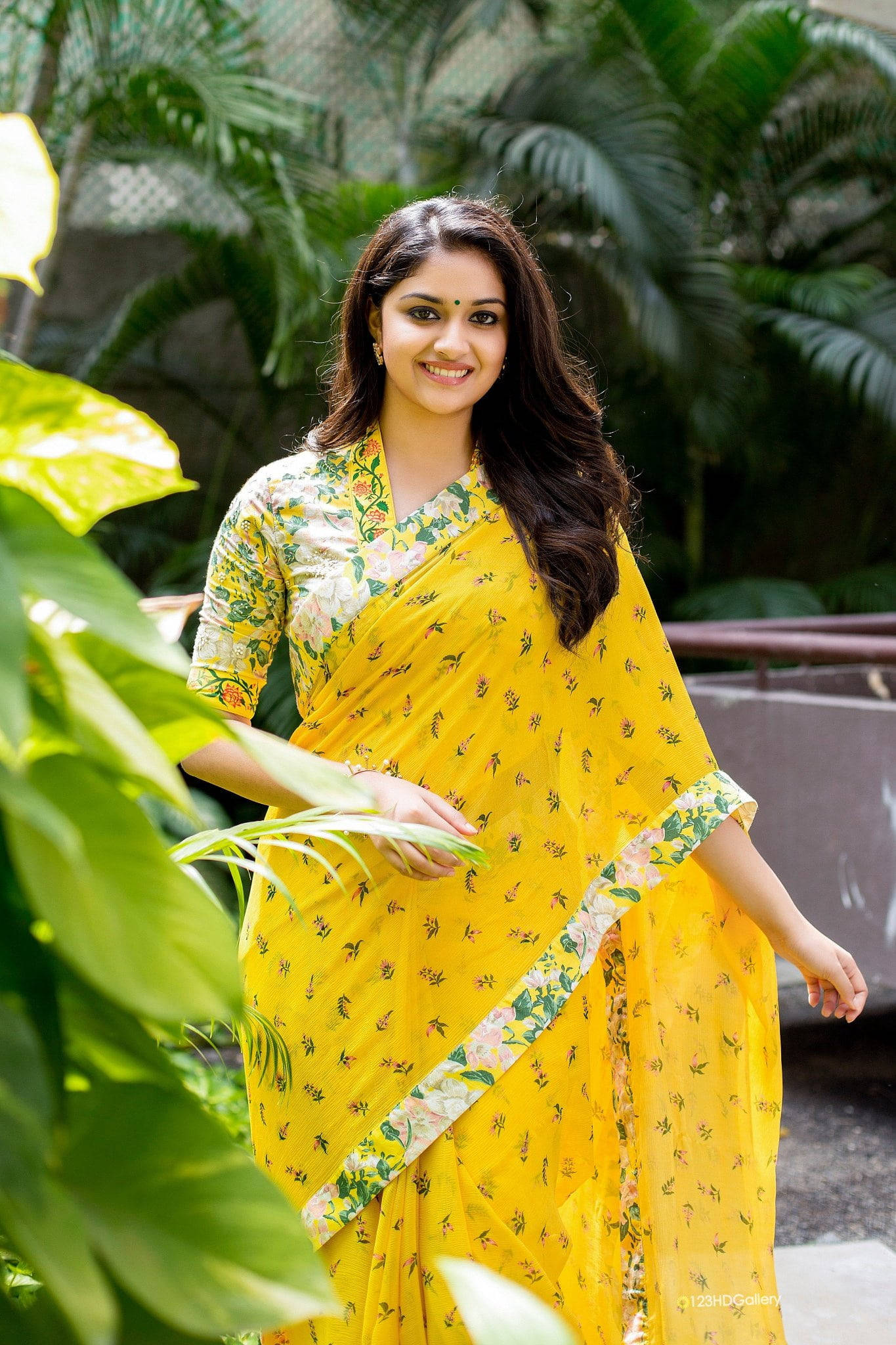Keerthi Suresh, yellow floral saree, lush green tropical foliage, Full HD Phone Wallpaper
