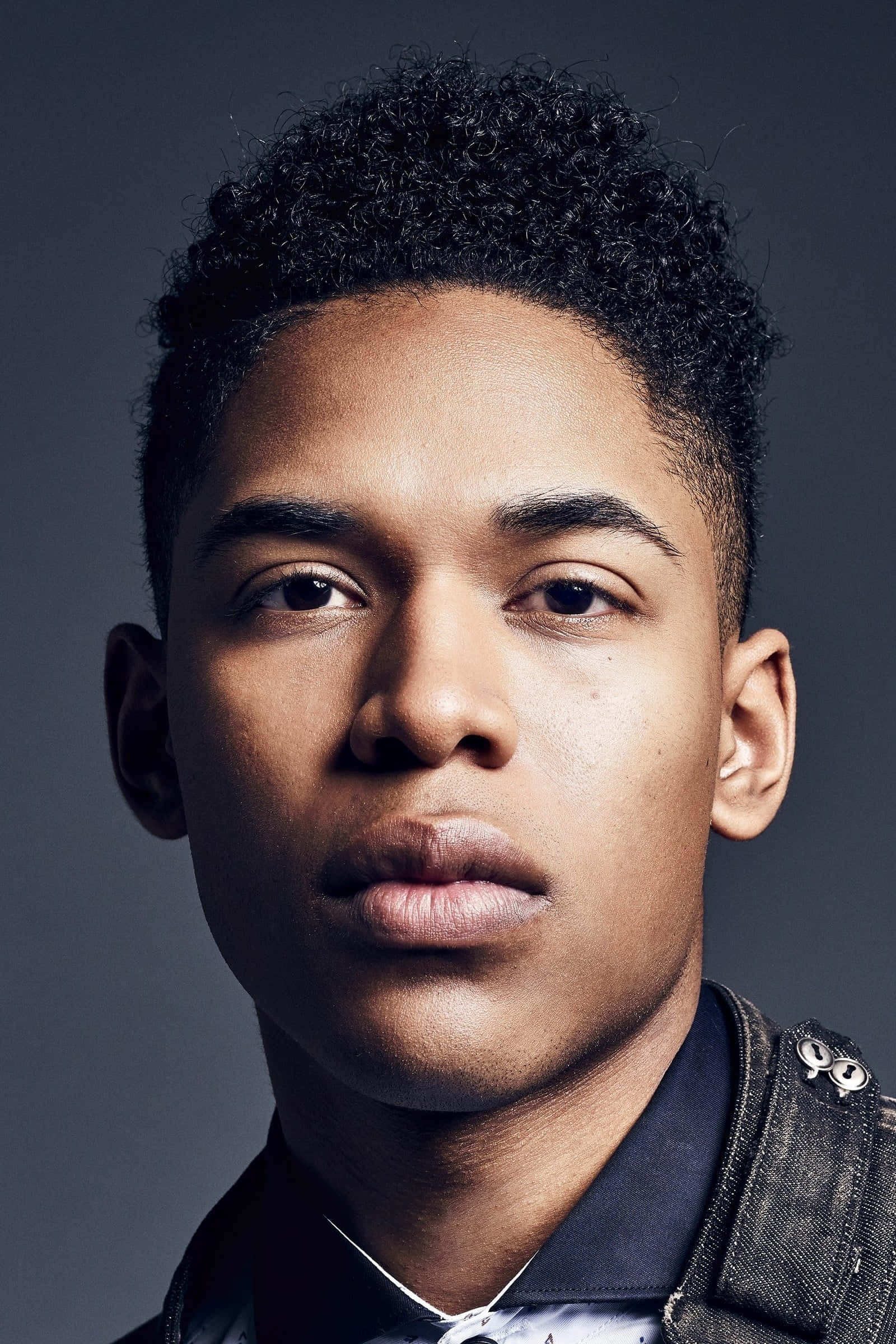 Kelvin Harrison Jr, curly black hair, muted gray studio backdrop, Full HD Phone Wallpaper