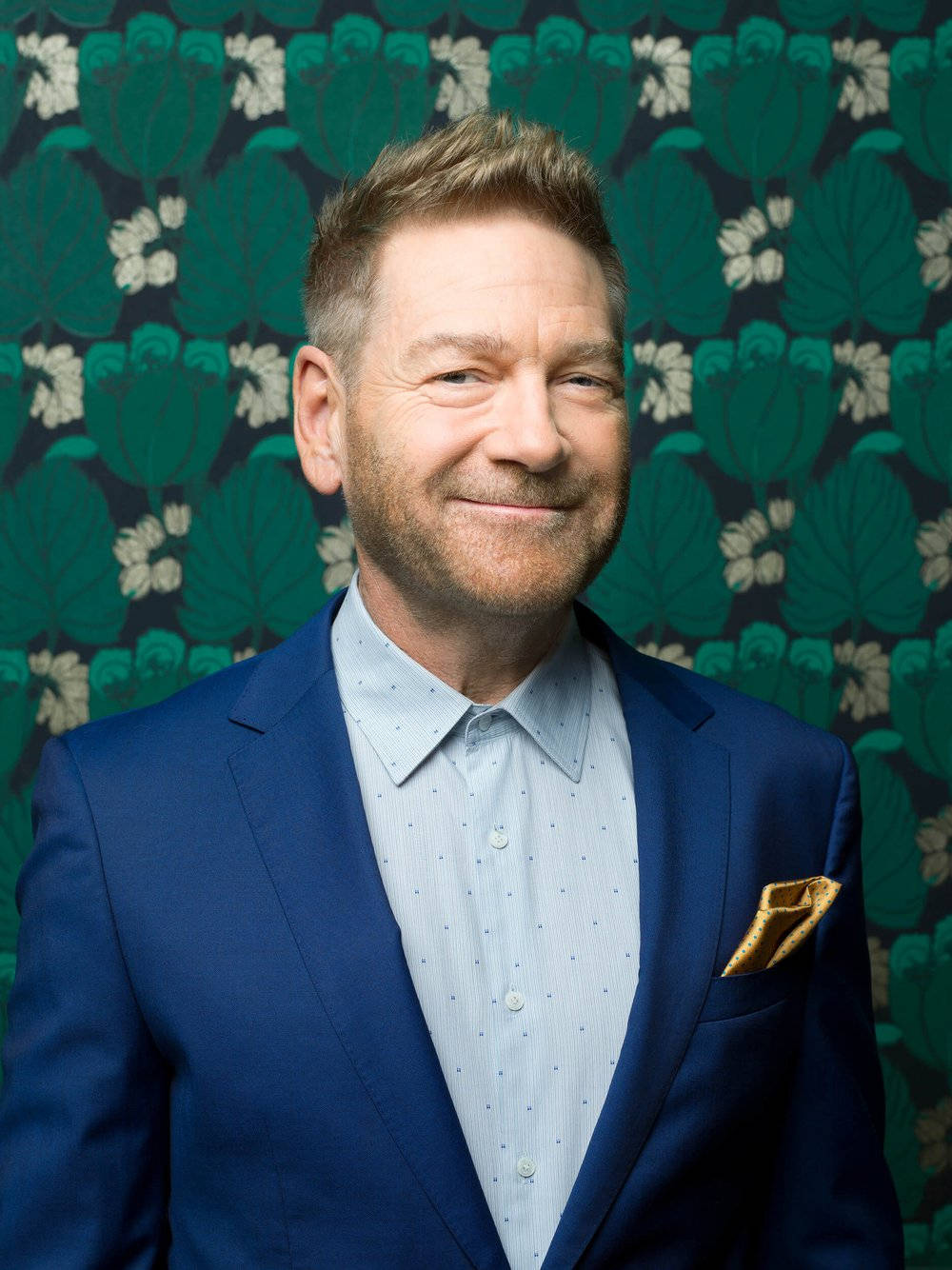 Kenneth Branagh, blue suit, vibrant green floral wallpaper, HD Phone Wallpaper