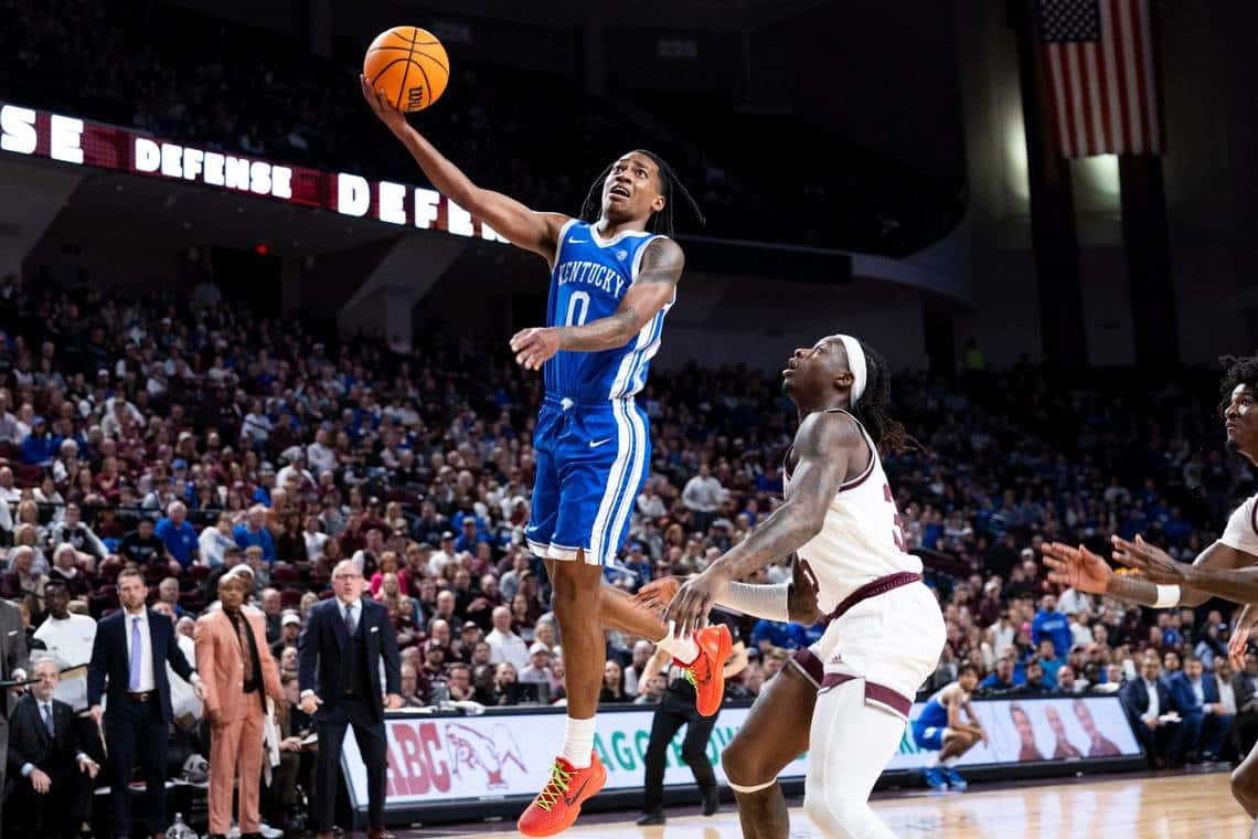 Kentucky basketball player, blue jersey, white defender, SD Desktop Wallpaper