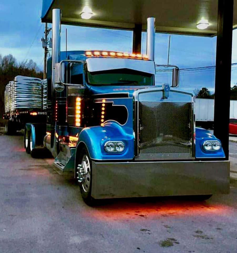Kenworth C500, gleaming blue, glowing amber lights, SD Phone Wallpaper