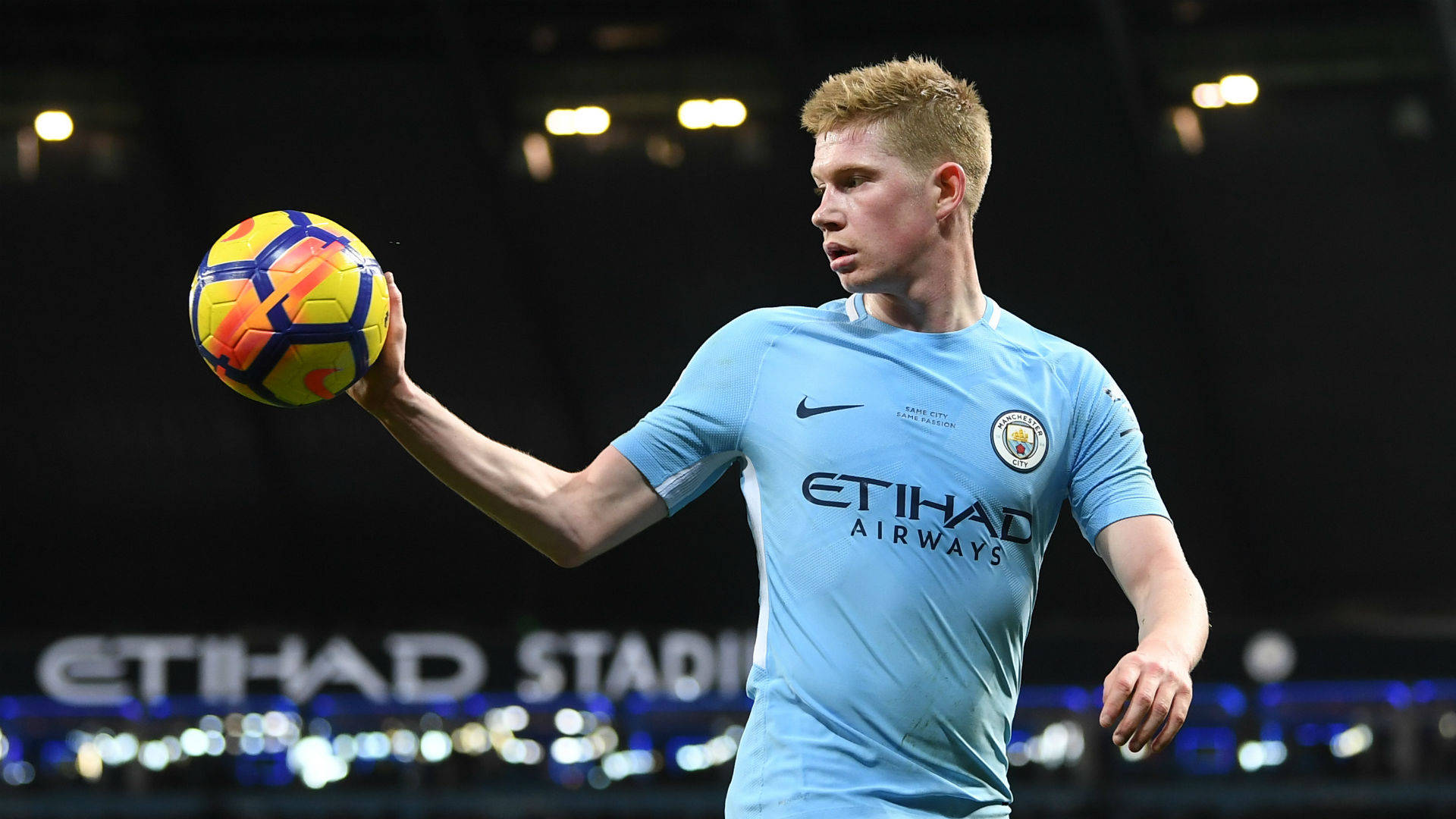Kevin De Bruyne, light blue Manchester City jersey, vibrant yellow and orange ball, Full HD Desktop Wallpaper