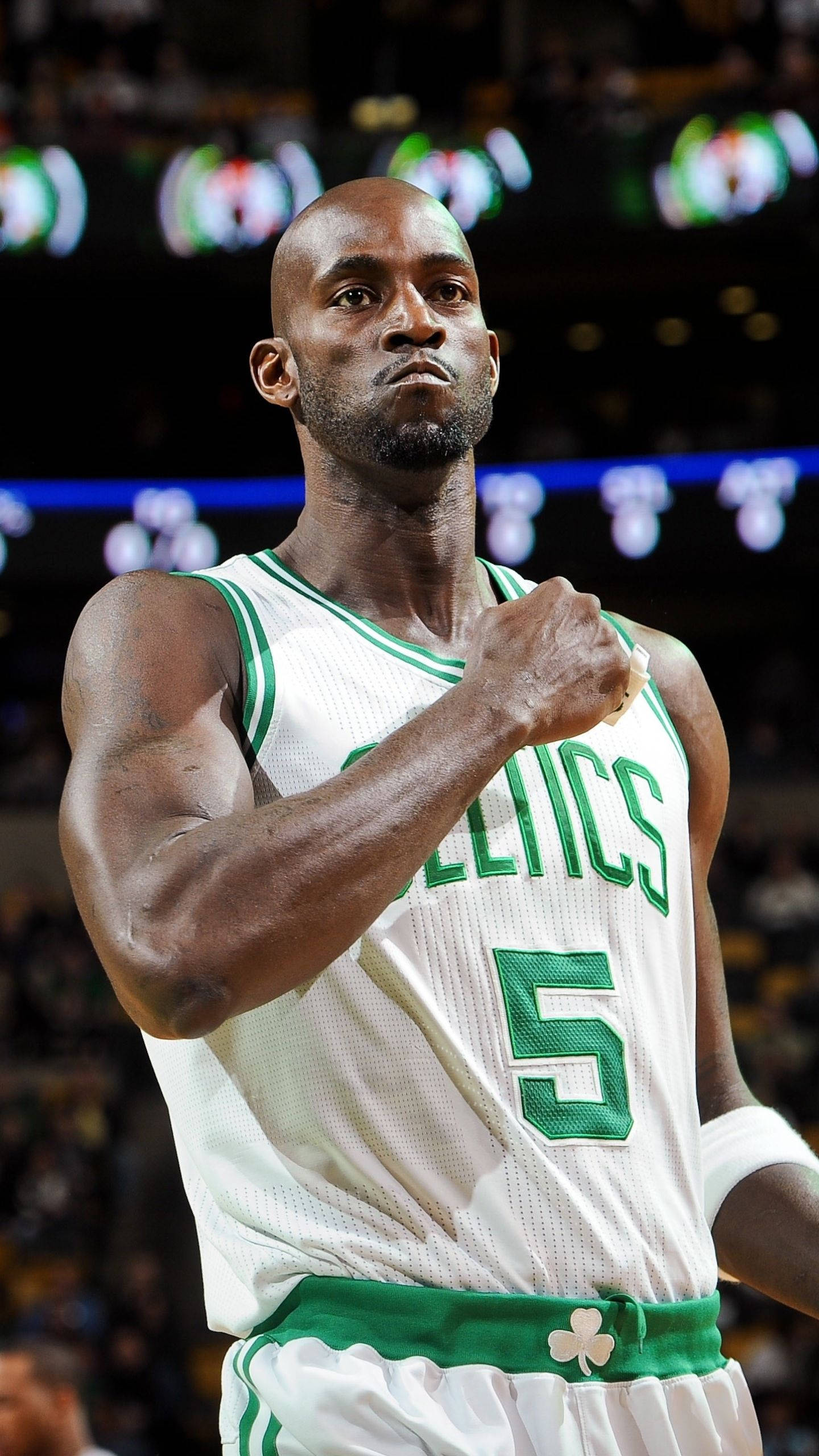 Kevin Garnett, green and white Celtics jersey, bright arena lights, 2K Phone Wallpaper