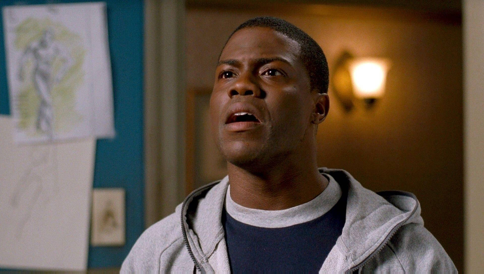 Kevin Hart, grey hoodie, warmly lit indoor hallway, Full HD Desktop Wallpaper