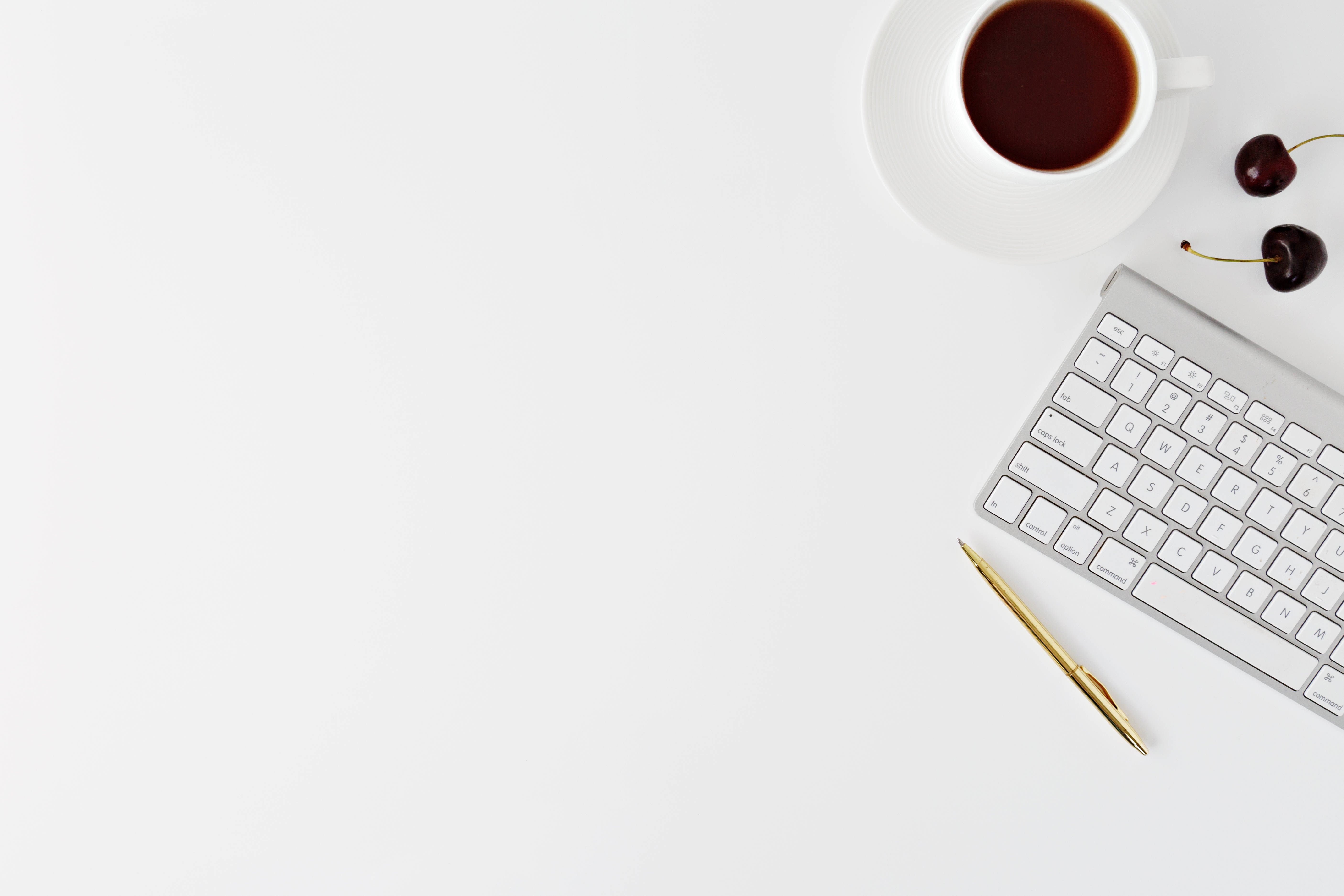 minimalist white desk, coffee keyboard, cherries, 5K Desktop Wallpaper