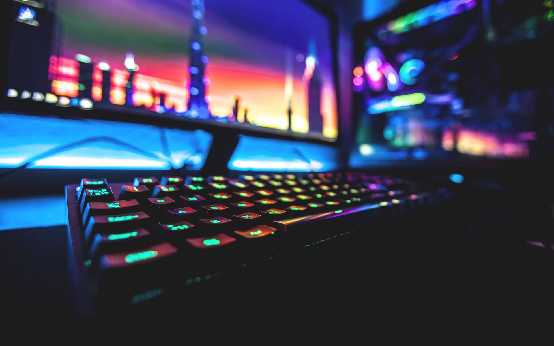 RGB keyboard, curved monitor, neon cityscape, Full HD Desktop Wallpaper