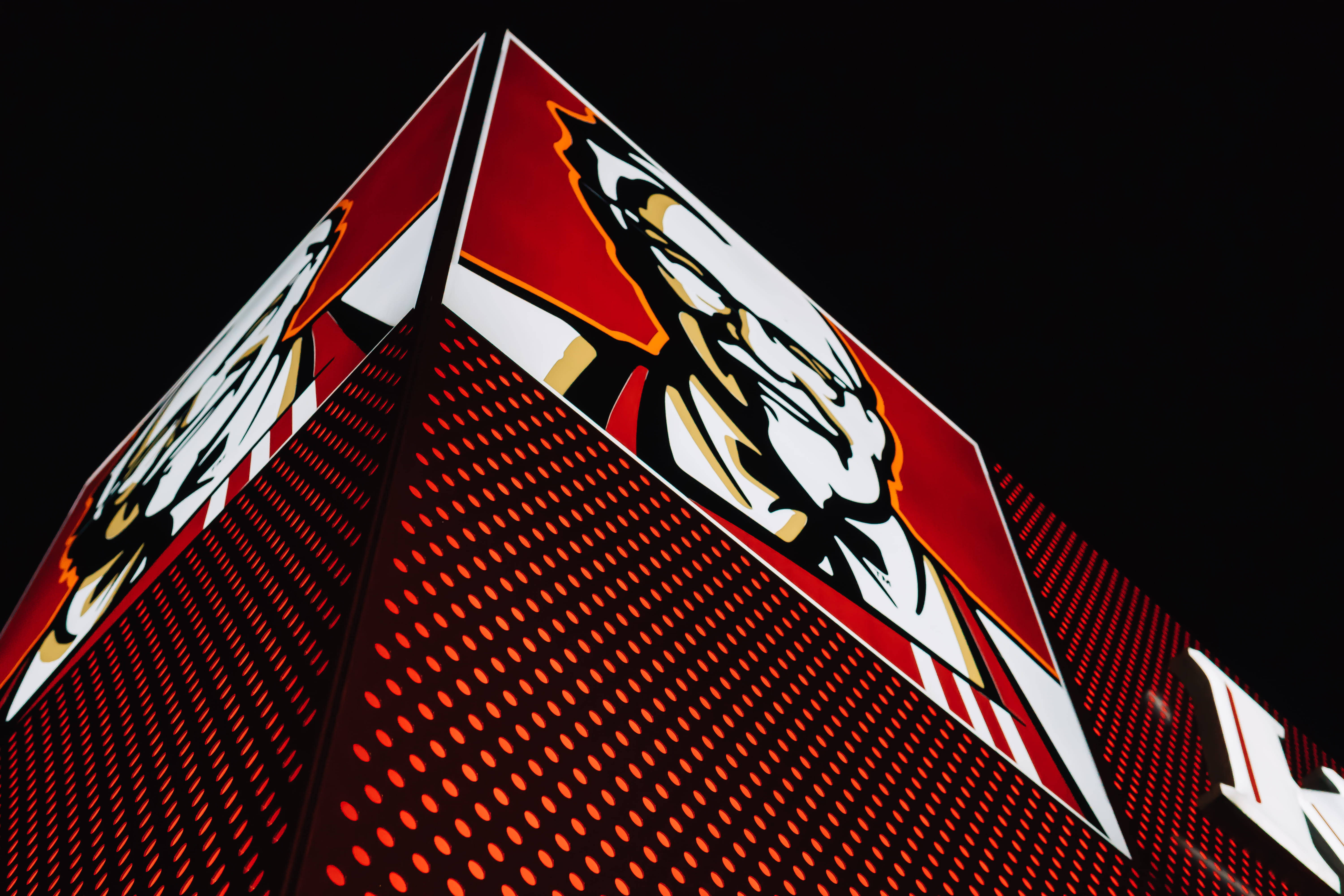 KFC, pyramid-shaped building, red perforated facade, 5K Desktop Wallpaper