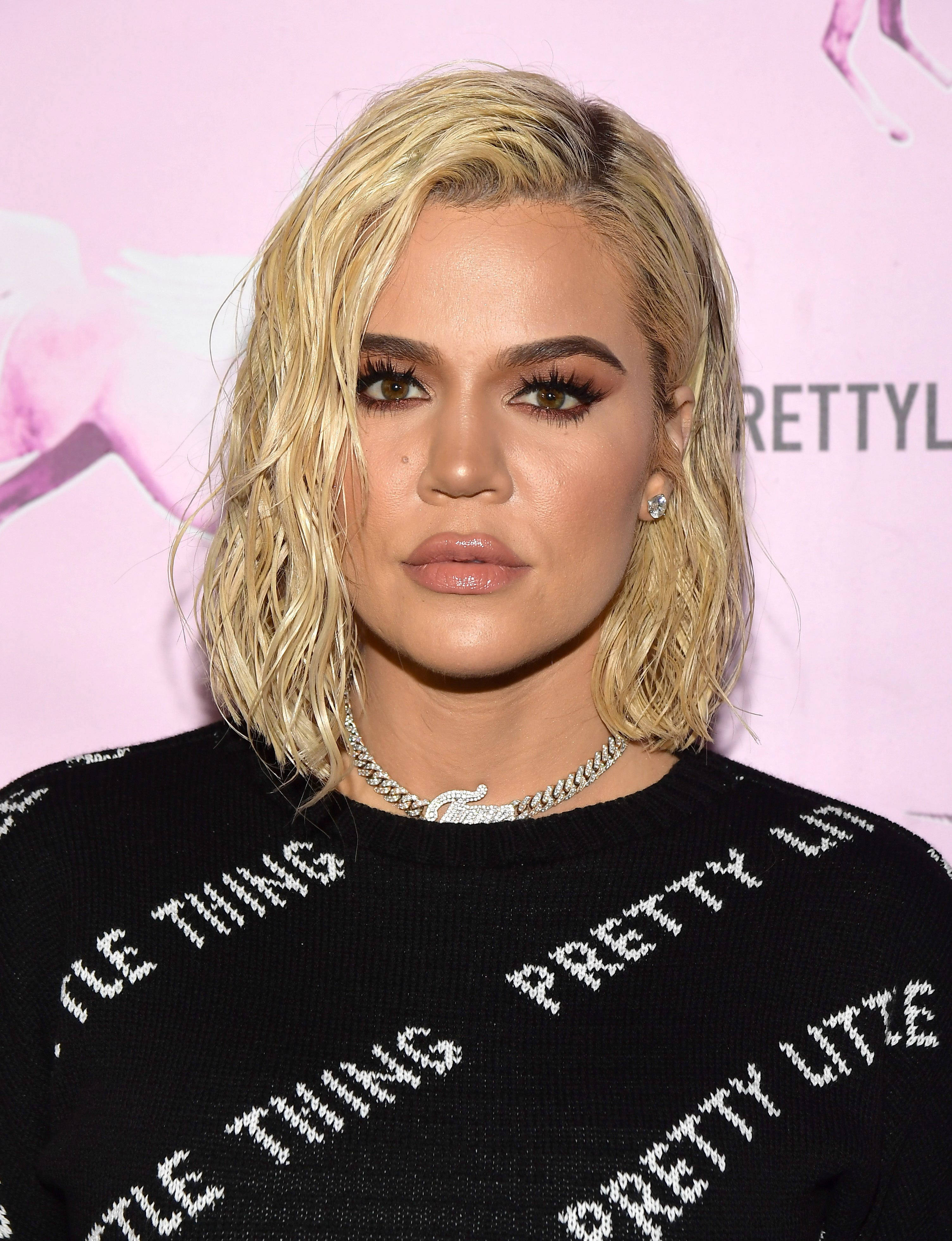 Khloe Kardashian, black sweater, white text, 4K Phone Wallpaper