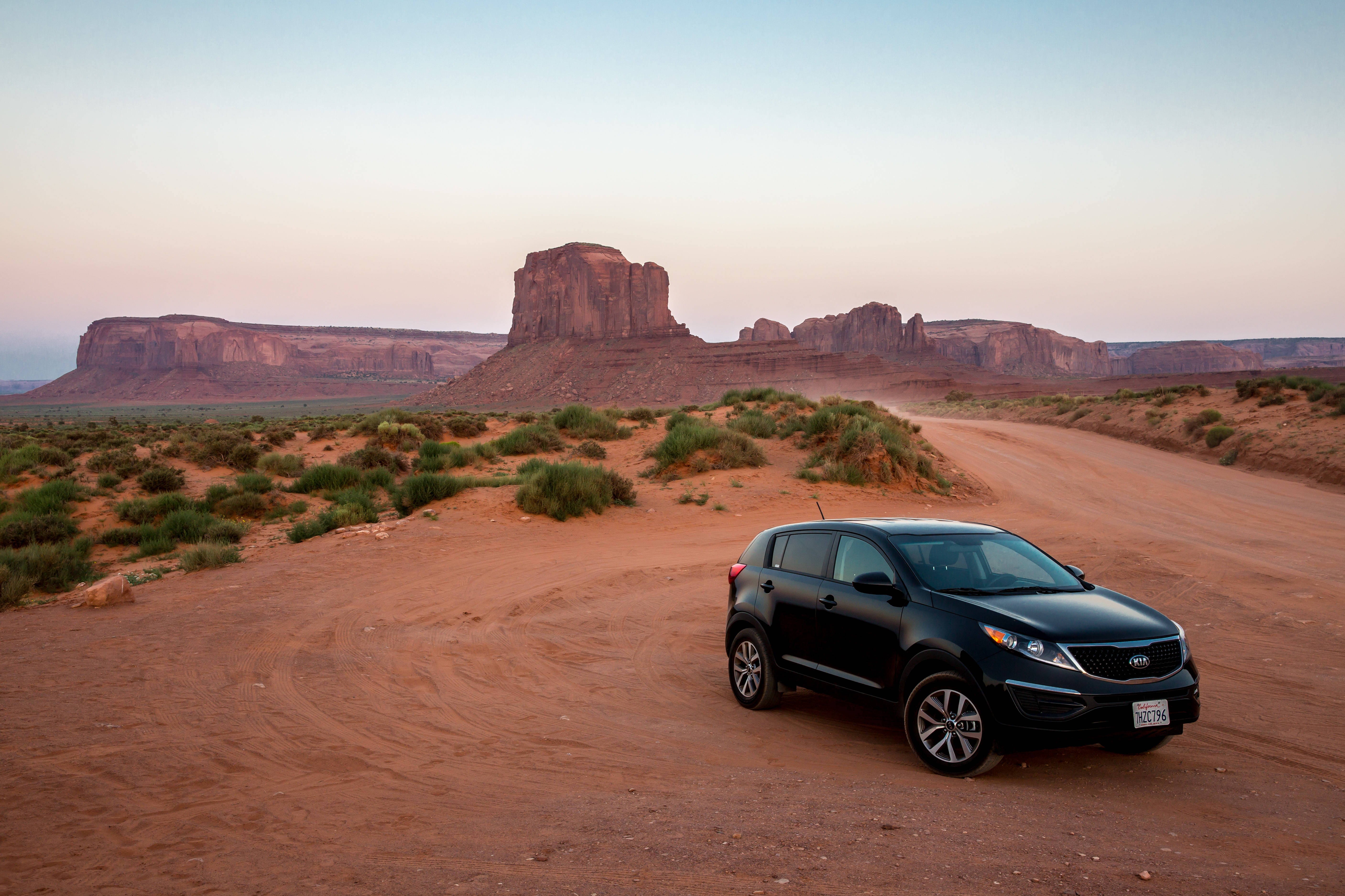 Kia, black SUV, winding dirt road, 5K Desktop Wallpaper