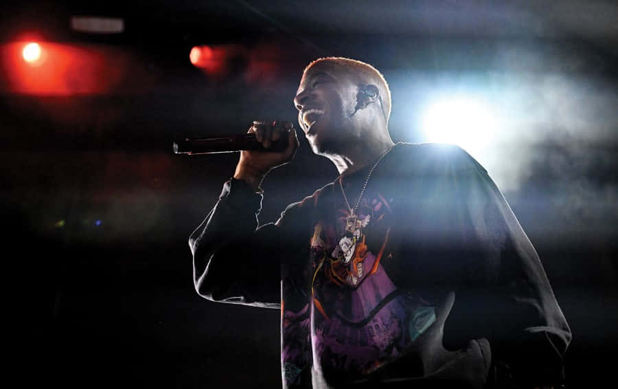 Kid Cudi, performing live on stage, dramatic red and white spotlights, SD Desktop Wallpaper