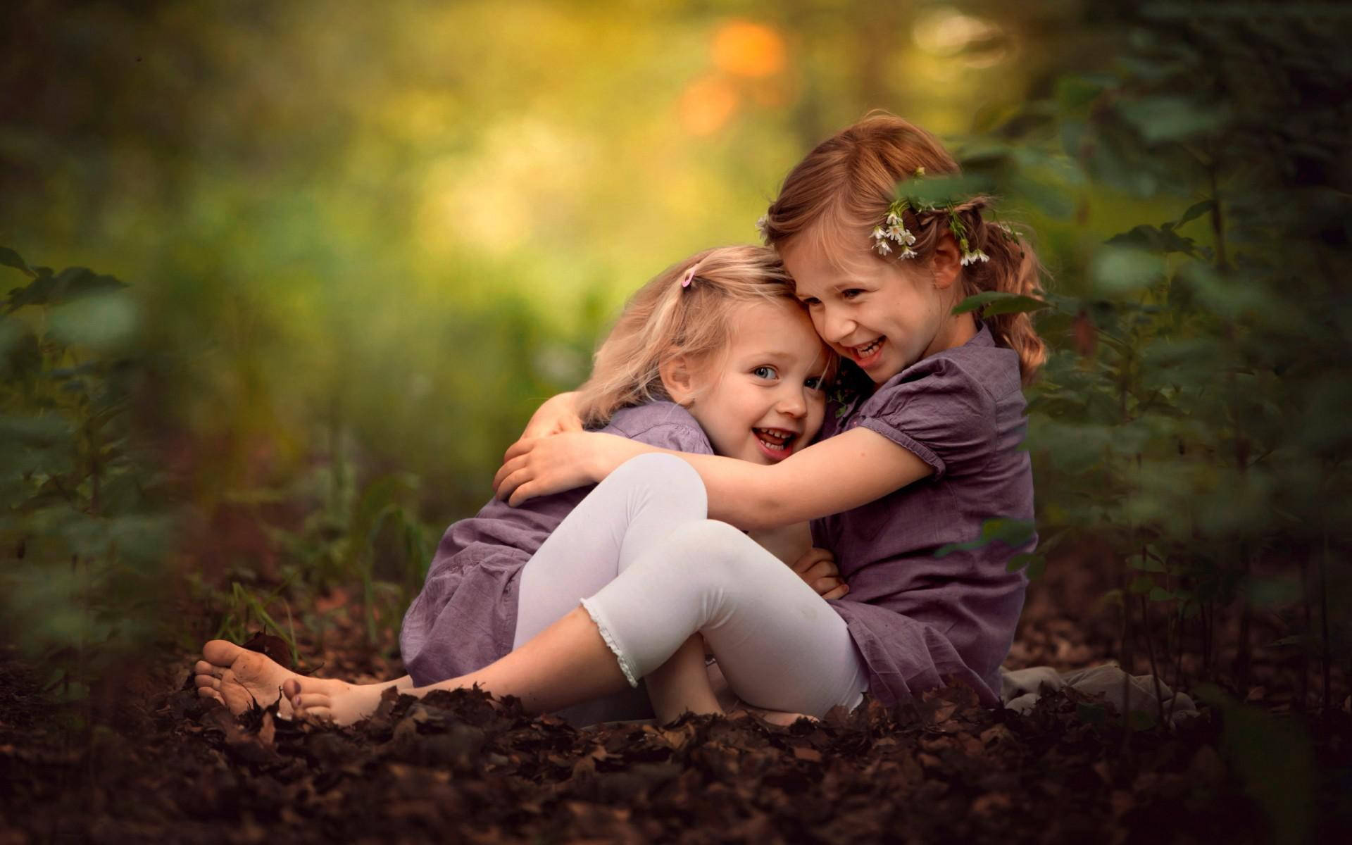 Cute Sister Laughter, sunlit forest clearing, soft green foliage, Full HD Desktop Wallpaper