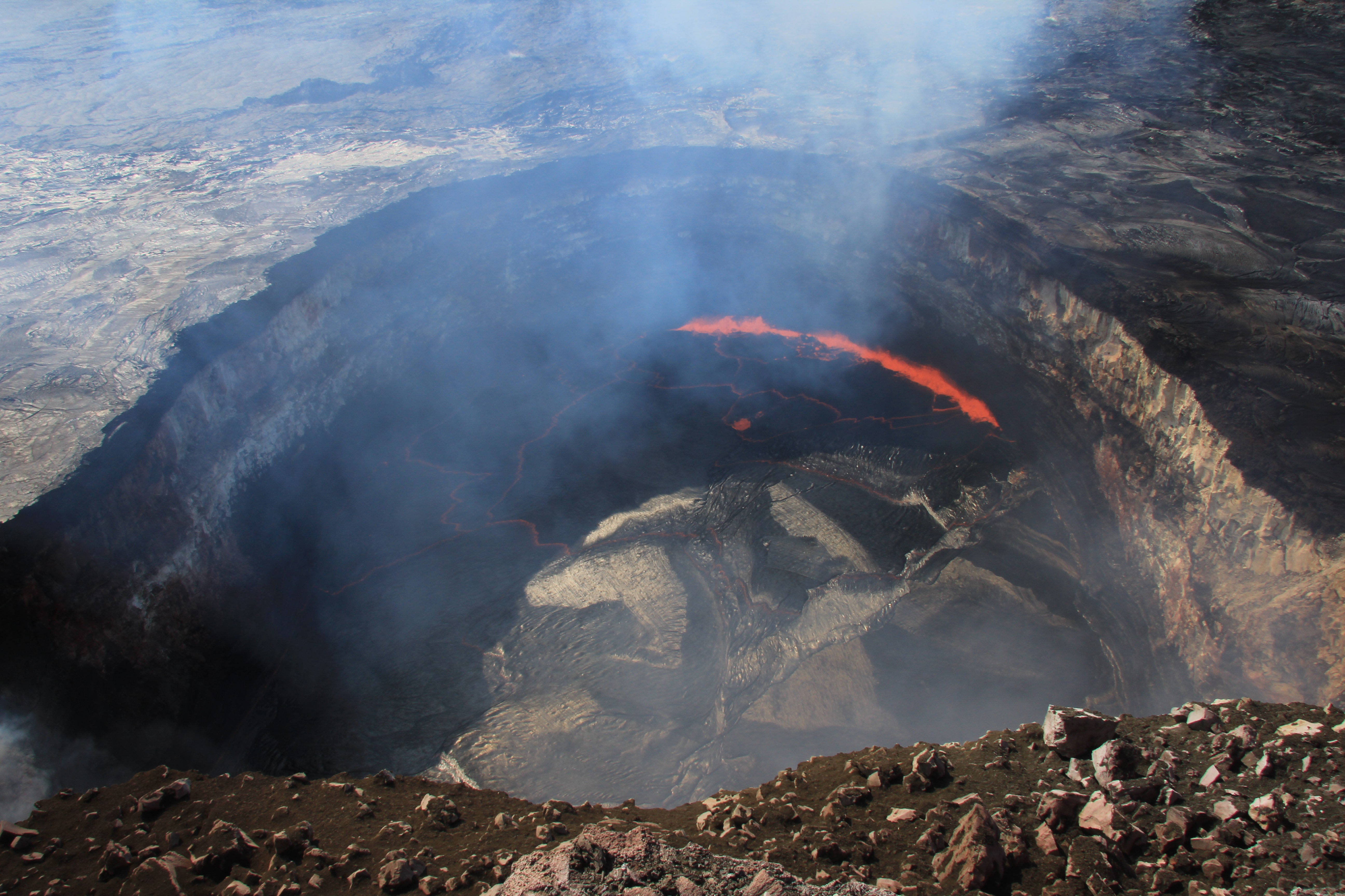 Kilauea Volcano, glowing orange lava, rugged black and gray rock, 5K Desktop Wallpaper