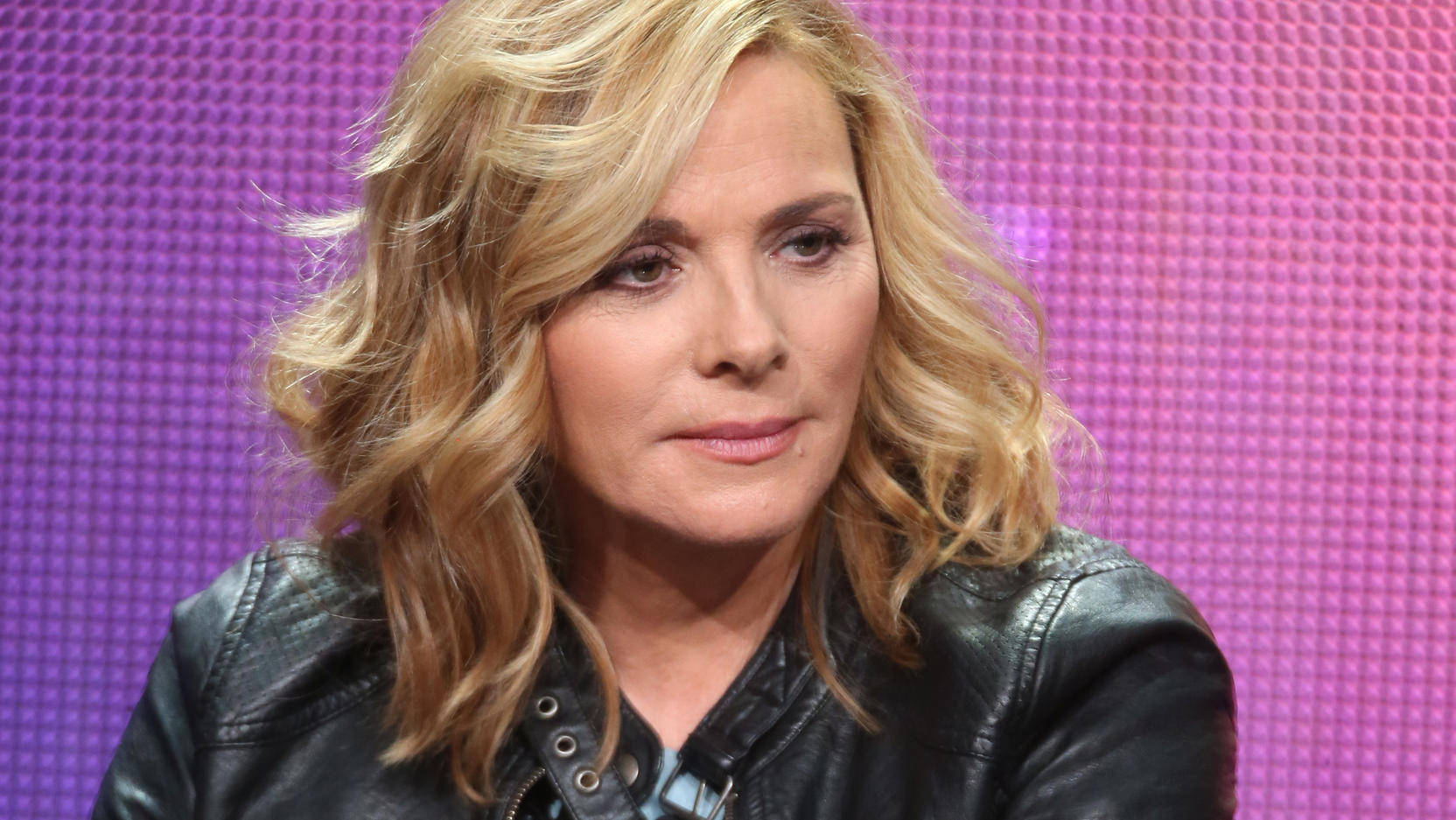 Kim Cattrall, black leather jacket, vibrant purple pixelated background, HD Desktop Wallpaper