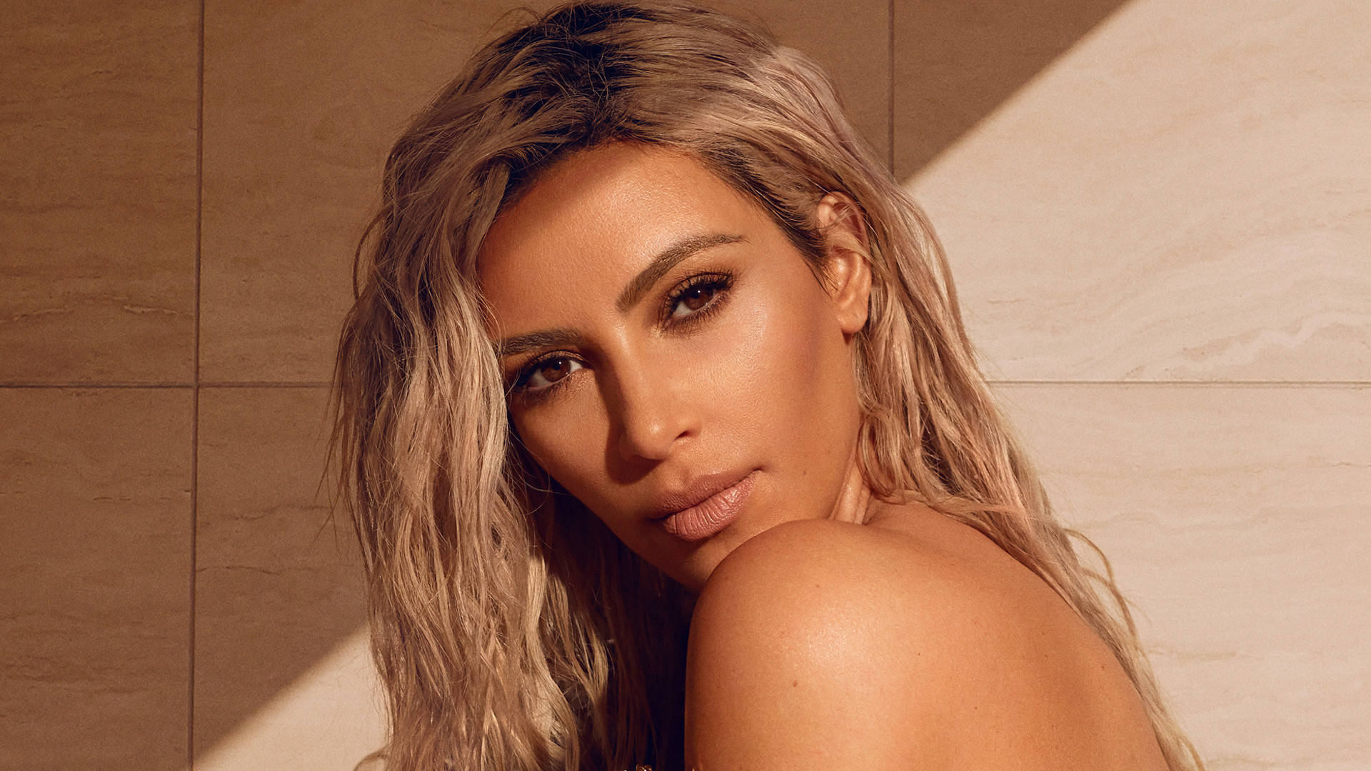 Kim Kardashian, wavy blonde hair, warm-toned tiled wall, Full HD Desktop Wallpaper
