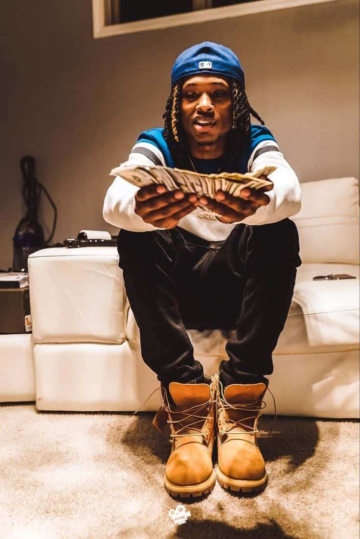 King Von, blue cap, white couch, SD Phone Wallpaper