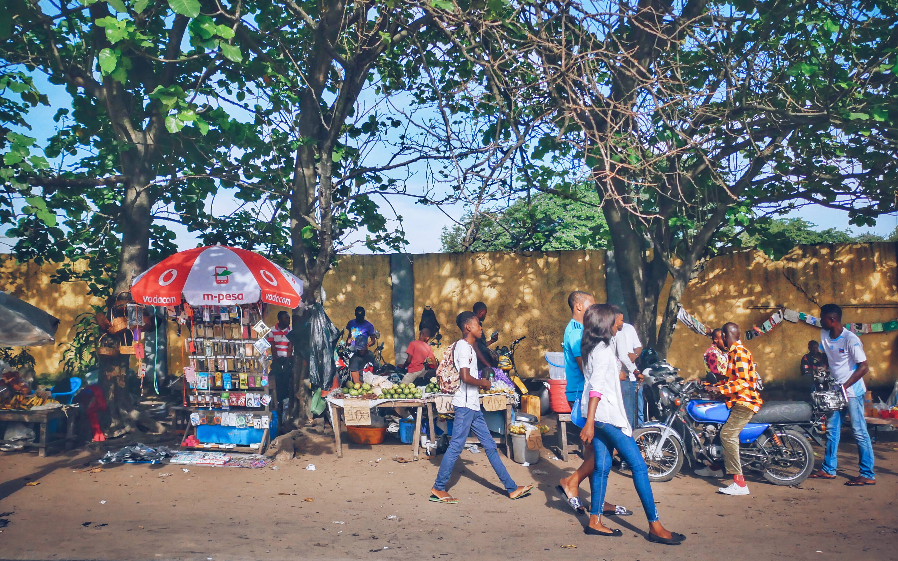 Kinshasa, street market, leafy trees, 2K Desktop Wallpaper