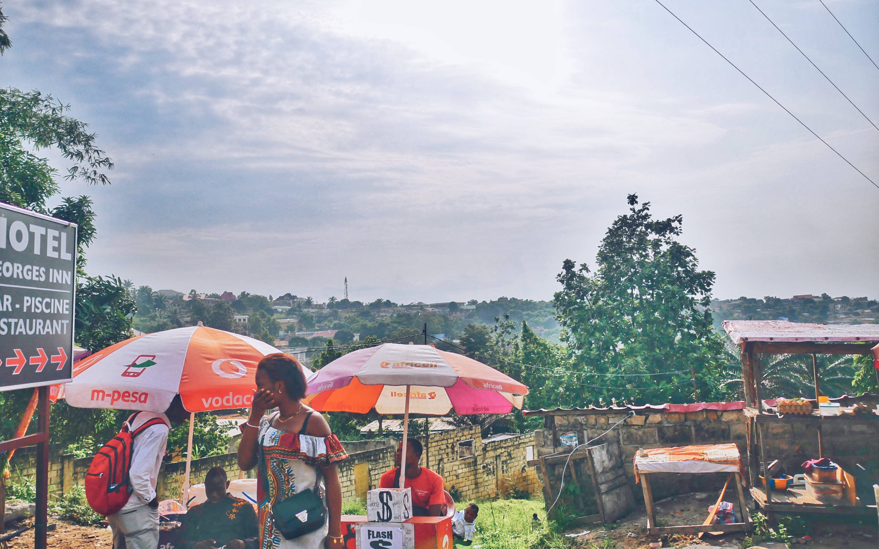 Kinshasa, colorful umbrellas, hotel sign, 2K Desktop Wallpaper