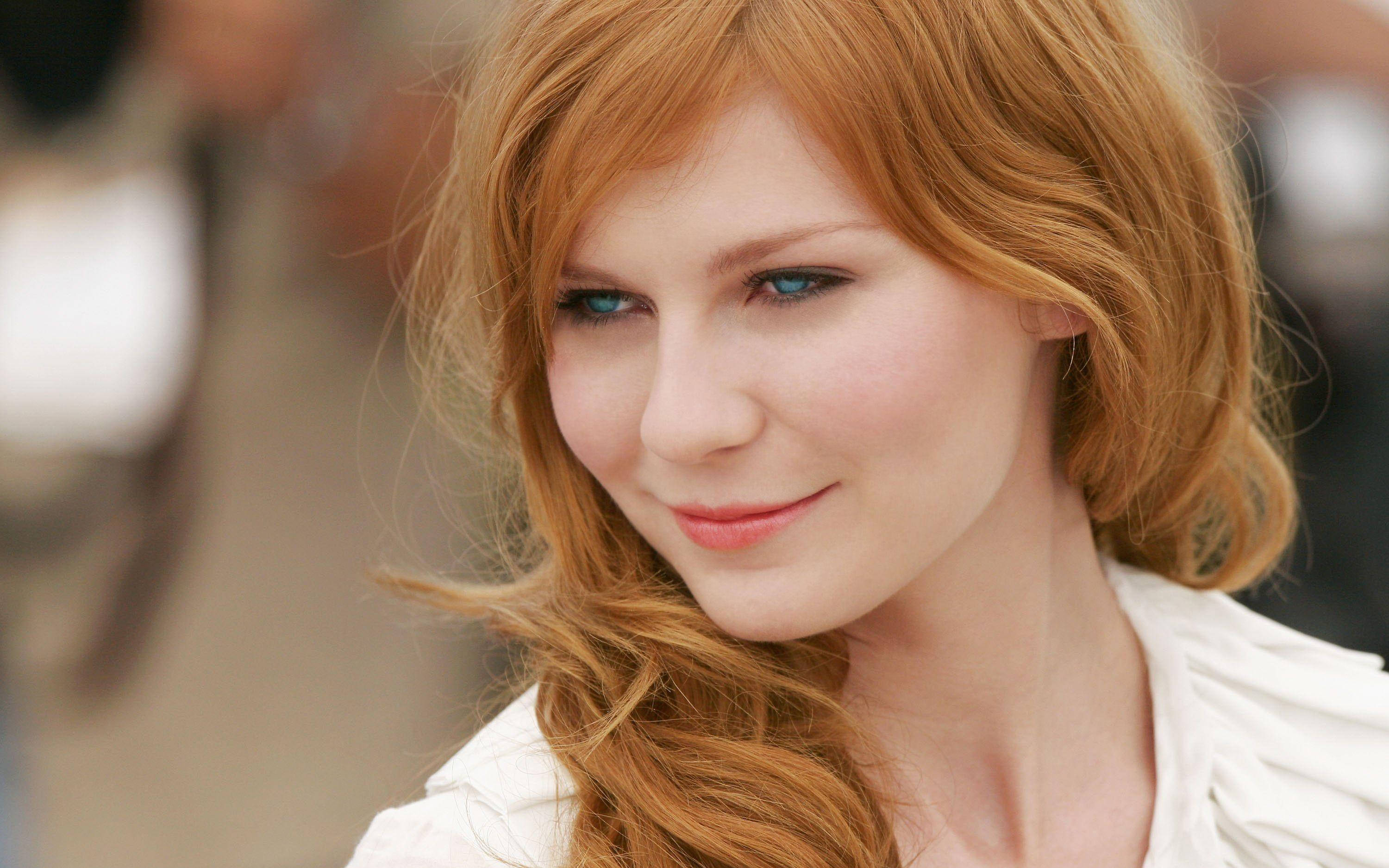 Kirsten Dunst, vibrant red hair, striking blue eyes, 2K Desktop Wallpaper