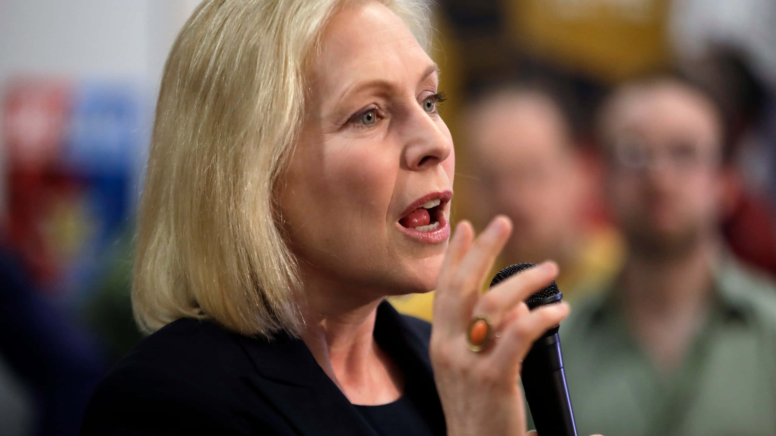 Kirsten Gillibrand, black blazer, microphone, 2K Desktop Wallpaper