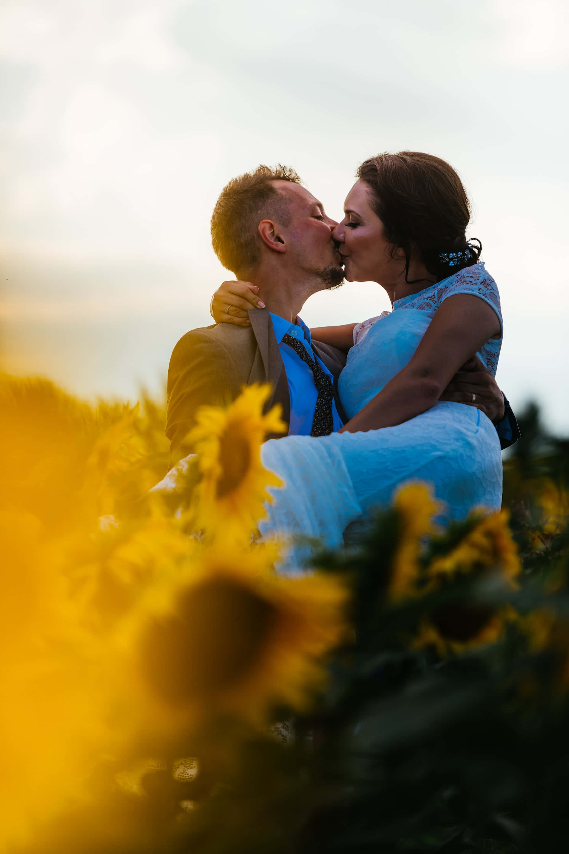 sweet couple, kissing lips, vibrant sunflower field, 2K Phone Wallpaper