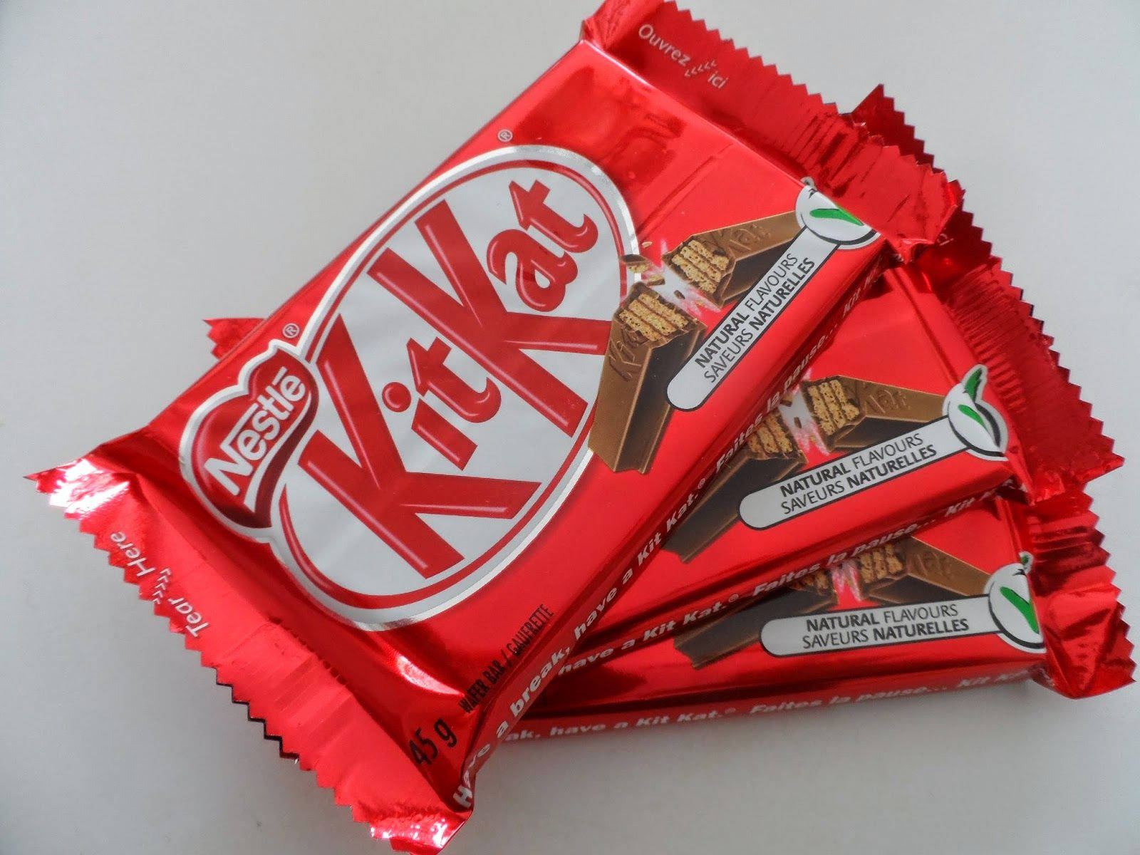 red KitKat, crinkled foil wrappers, stacked diagonally, HD Desktop Wallpaper