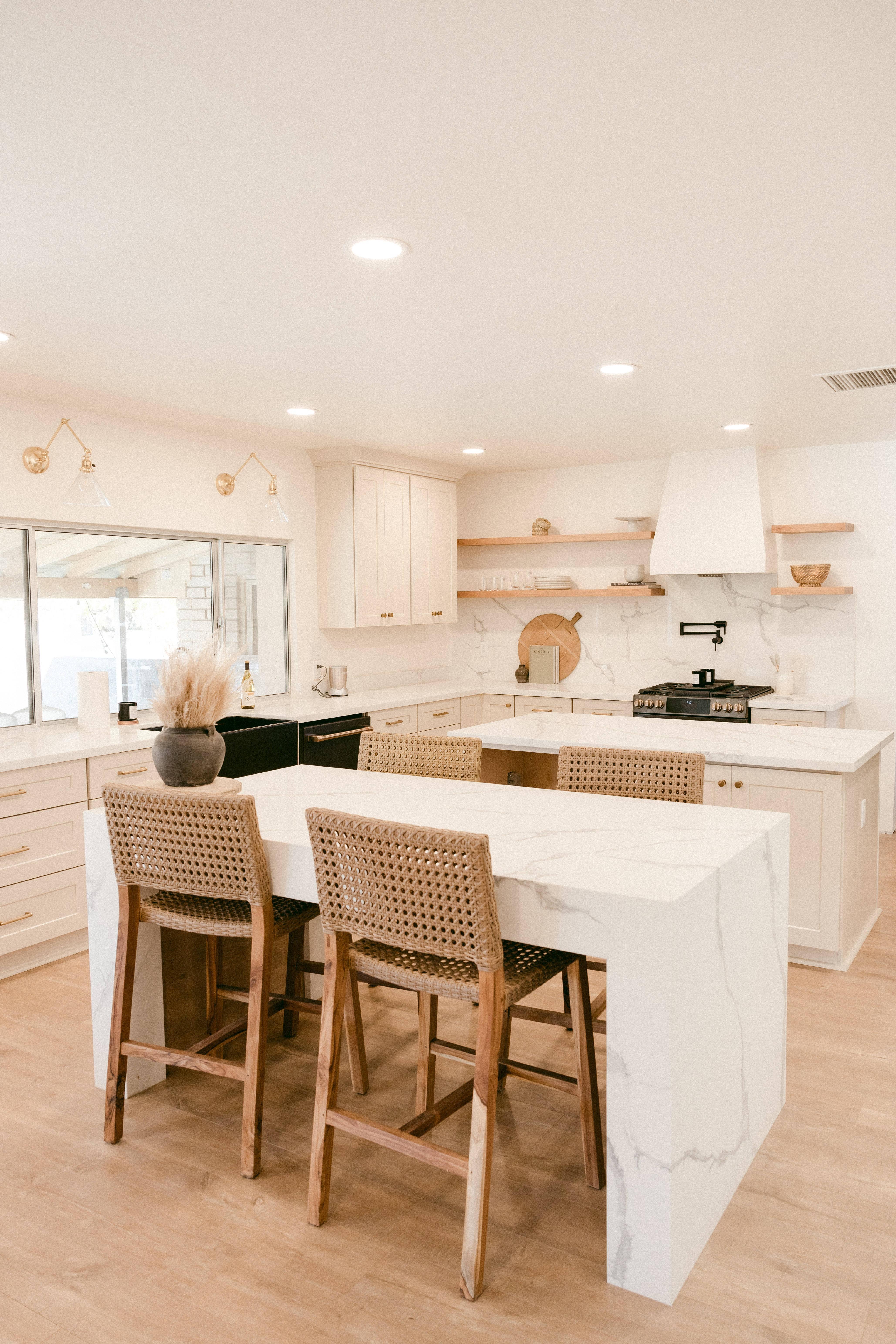 white marble countertops, woven bar stools, warm recessed lighting, 5K Phone Wallpaper