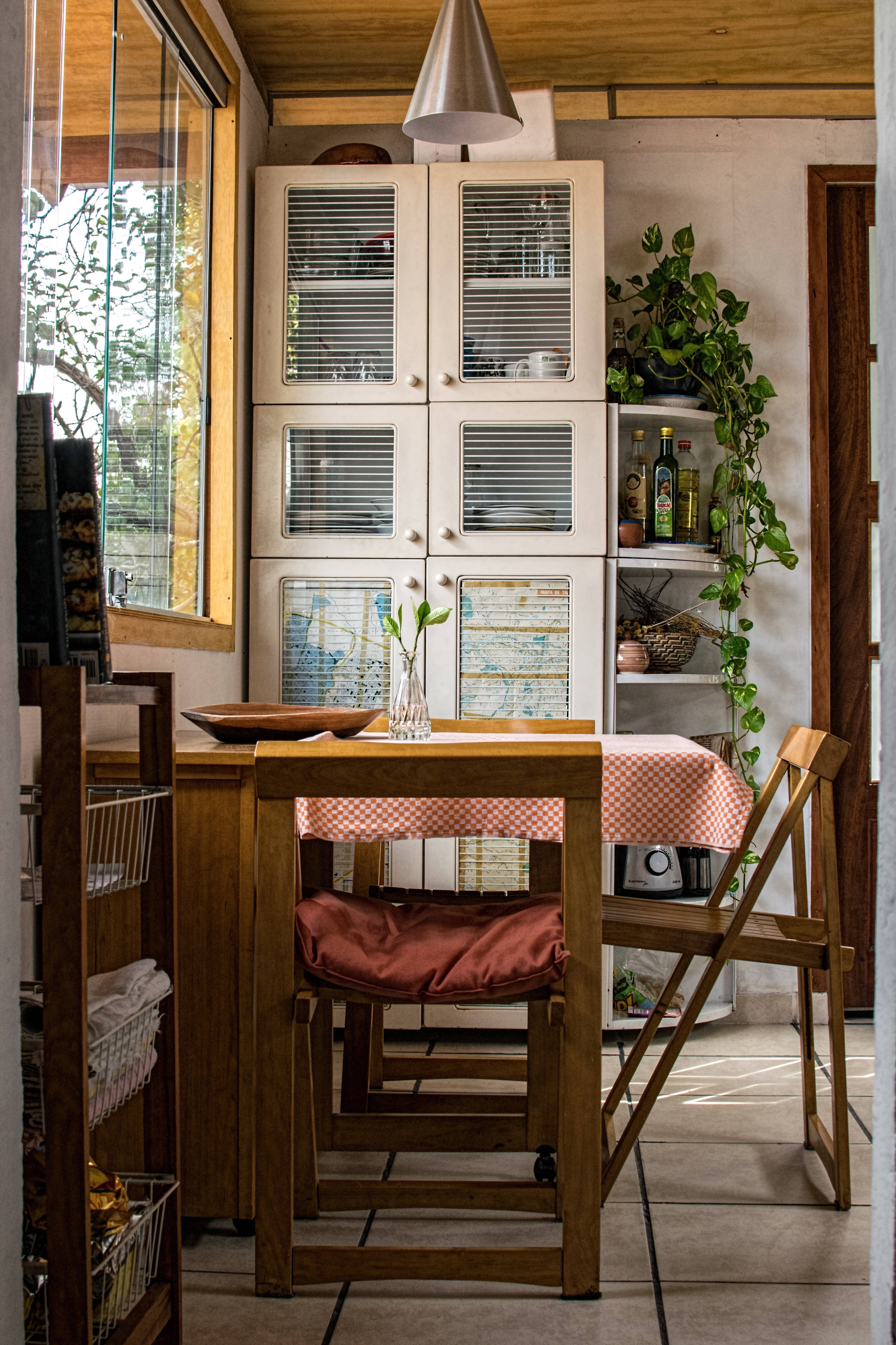 wooden dining nook, checkered tablecloth, potted plants, 5K Phone Wallpaper
