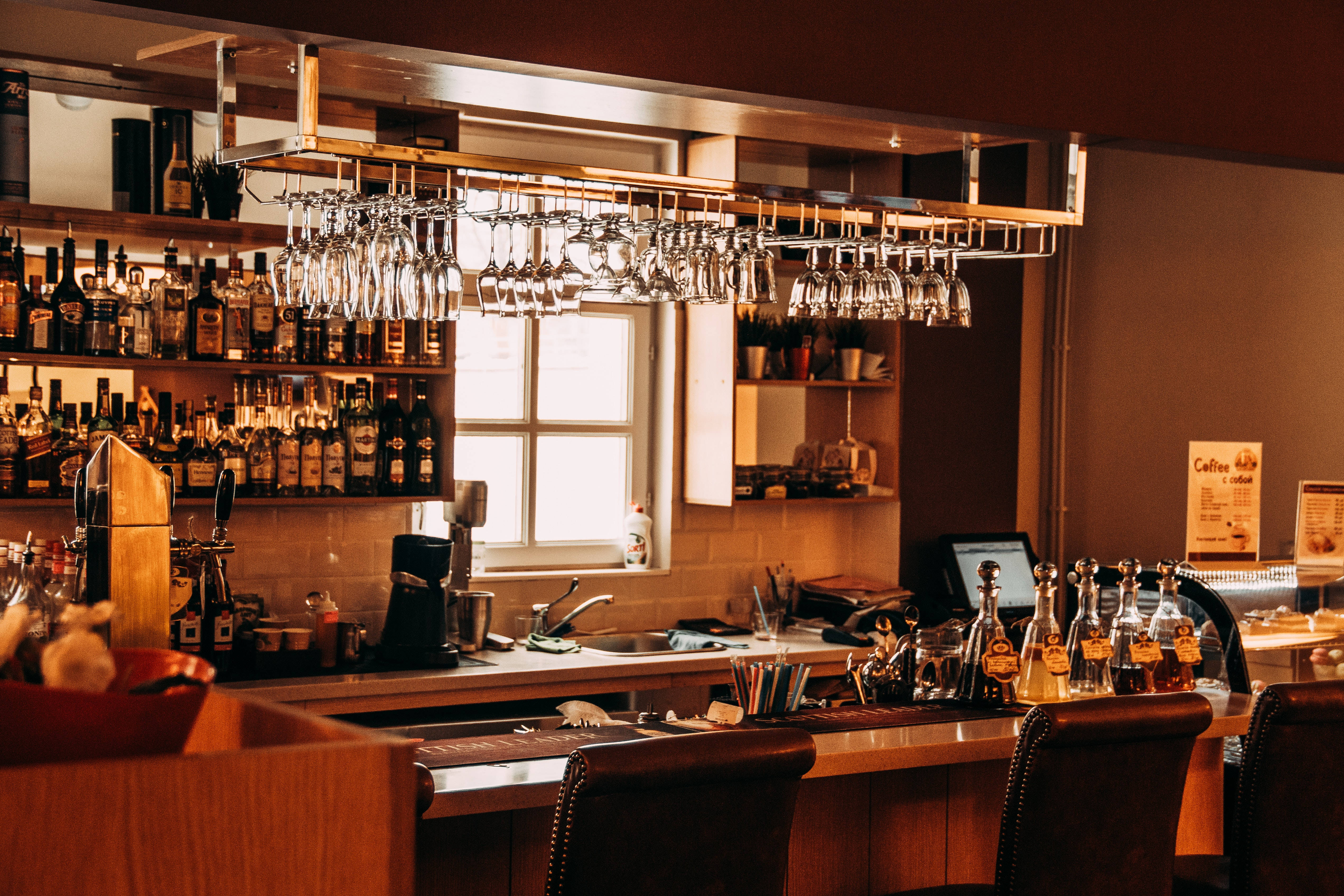 bar style kitchen, hanging glassware shelves, liquor bottles, 4K Desktop Wallpaper