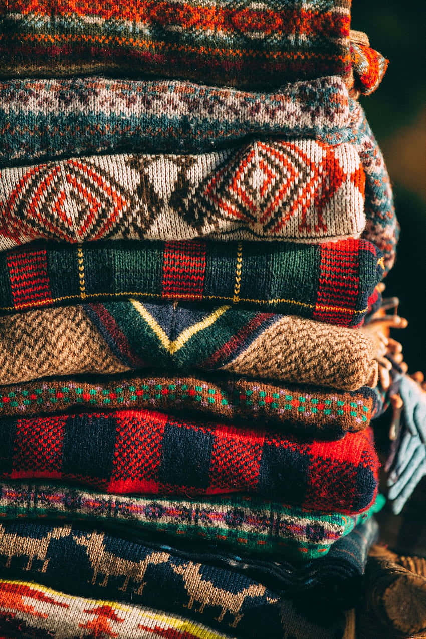 autumn vibe knitted sweaters, intricate design, rich reds browns and greens, SD Phone Wallpaper