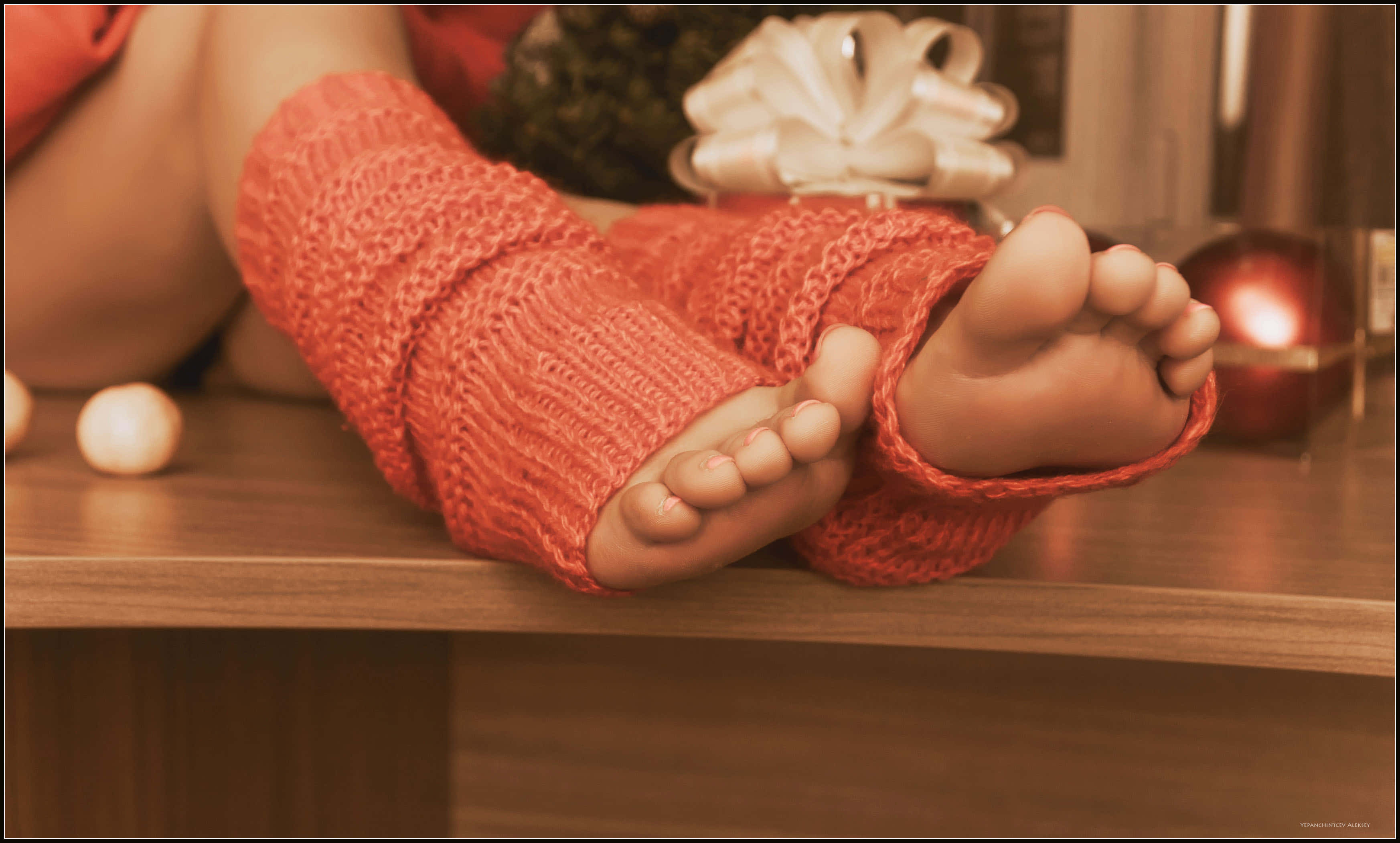 orange knit leg warmers, wooden surface, soft warm lighting, 2K Desktop Wallpaper