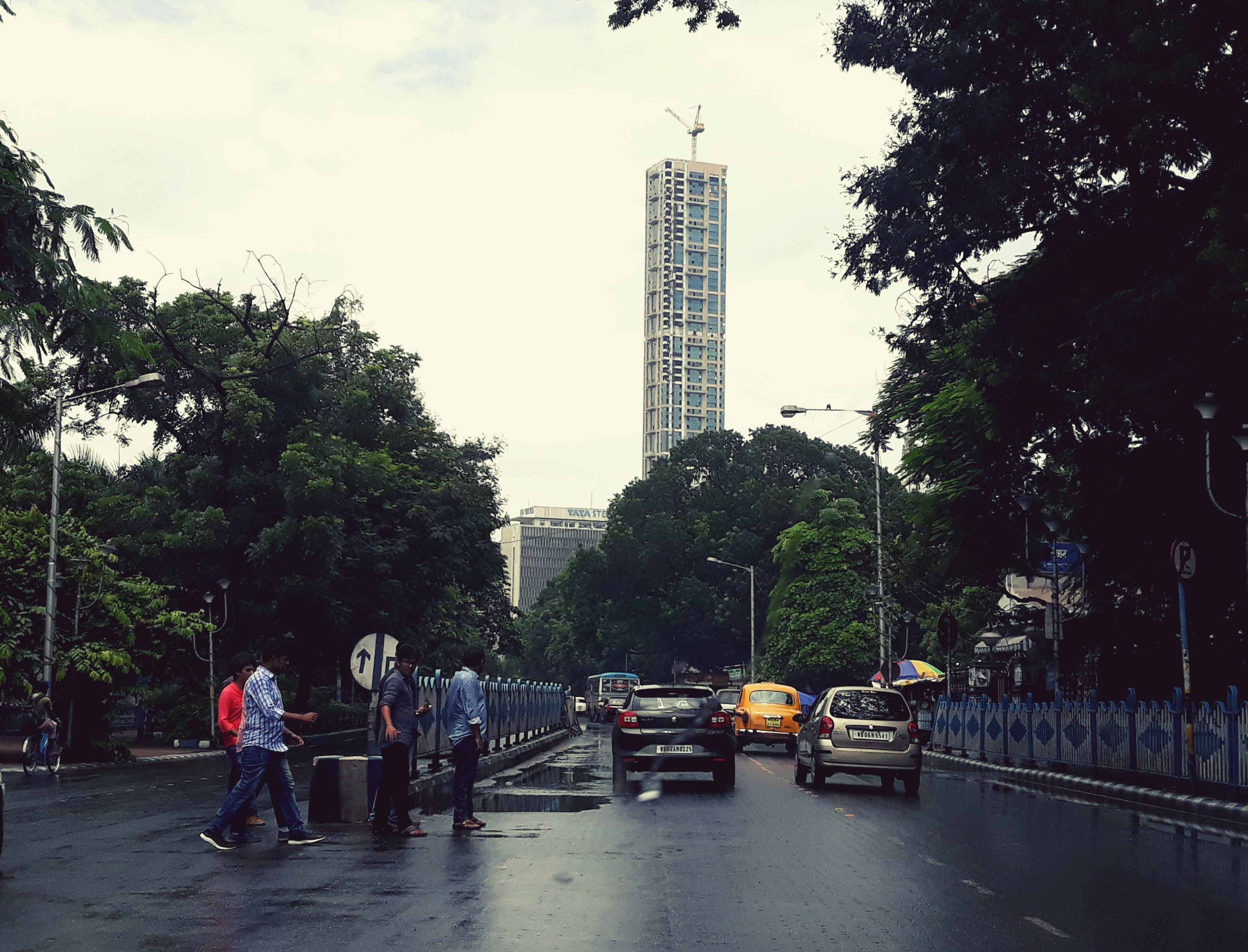 Kolkata, rainy urban street, wet road, 2K Desktop Wallpaper