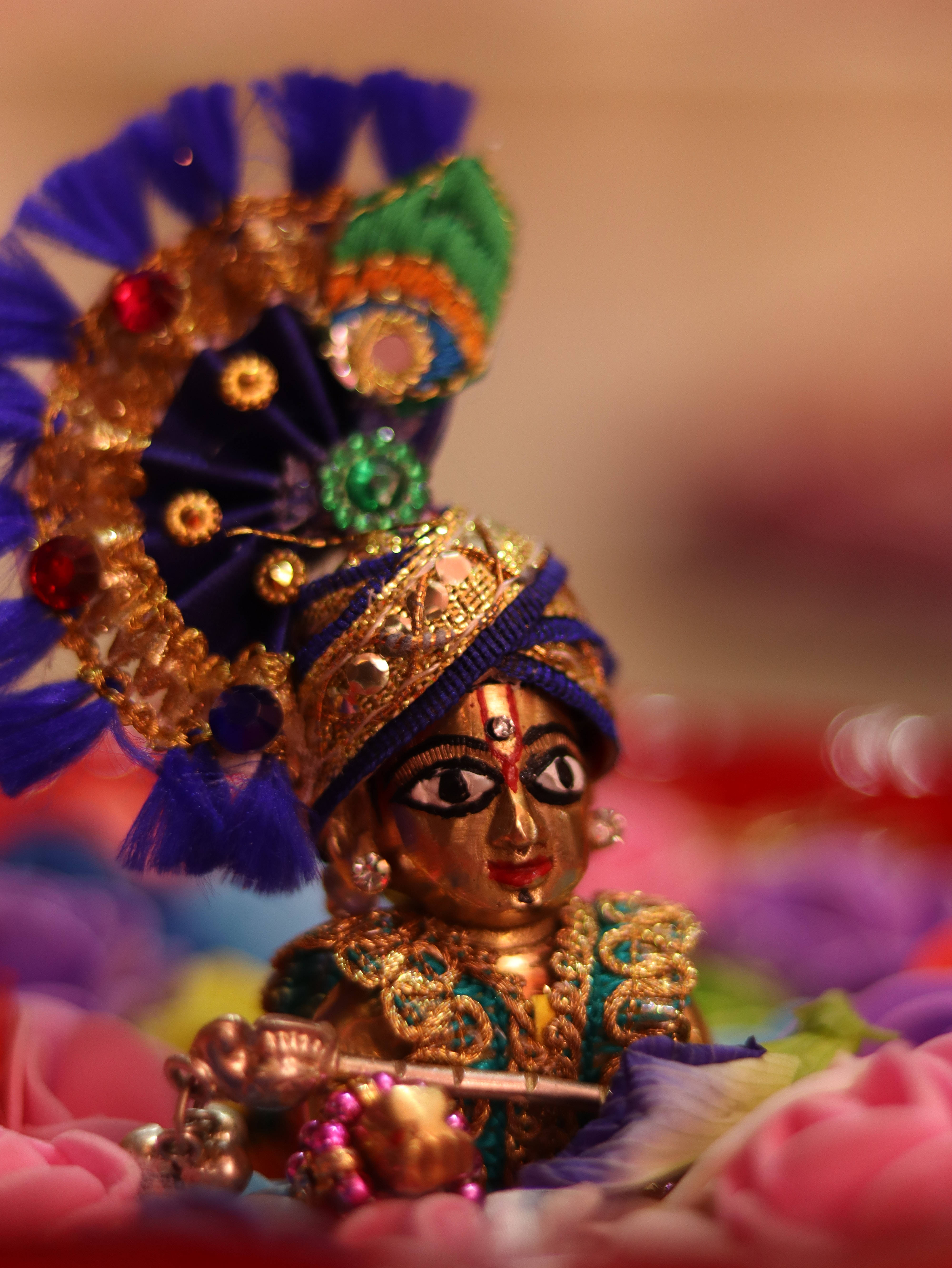 Krishna Phone, gold figurine, jewel-encrusted blue headdress, 5K Phone Wallpaper