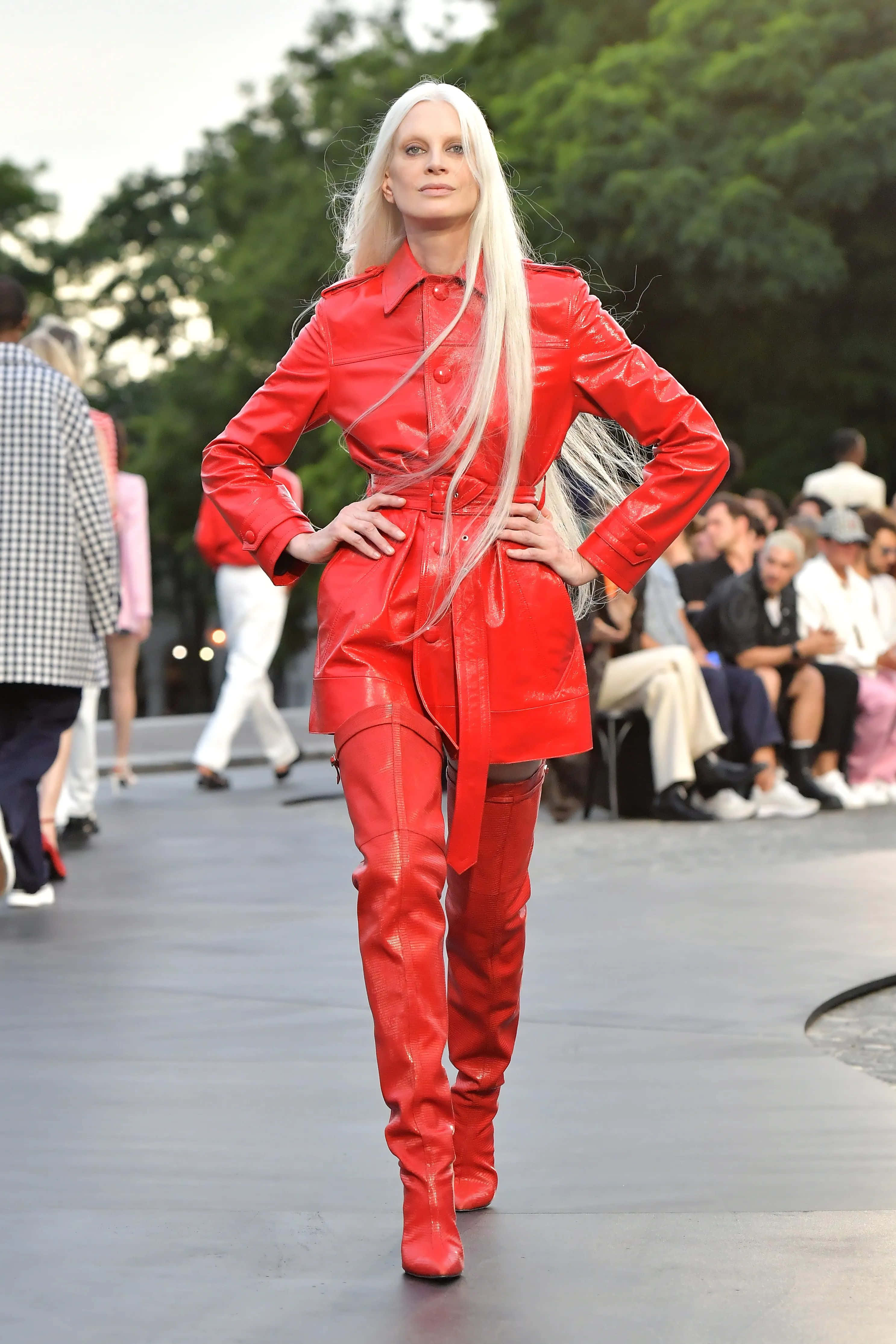 Kristen Mcmenamy, bold red leather trench coat, matching thigh-high boots, 4K Phone Wallpaper