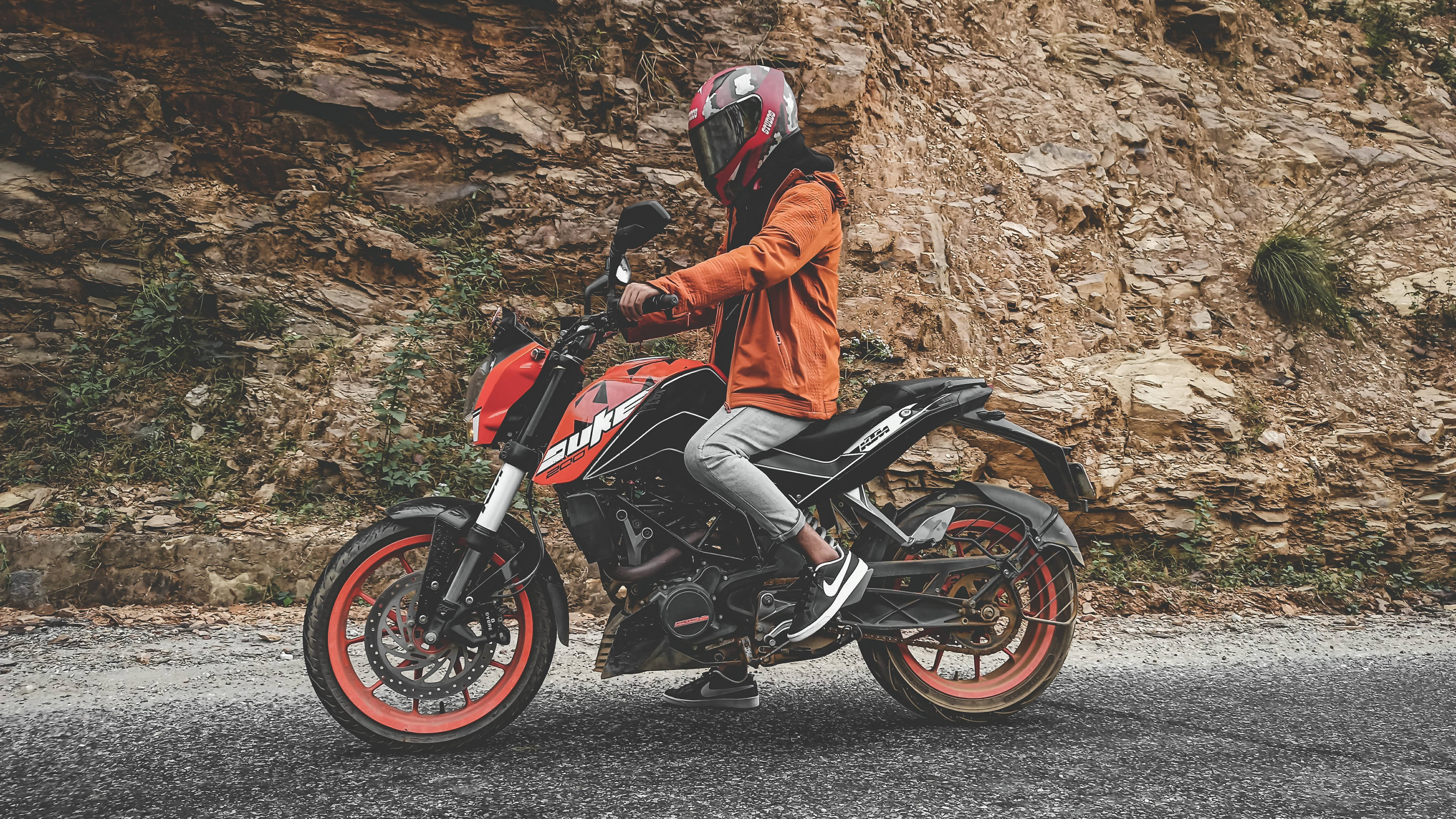 KTM Duke 200, orange jacket, red helmet, 4K Desktop Wallpaper