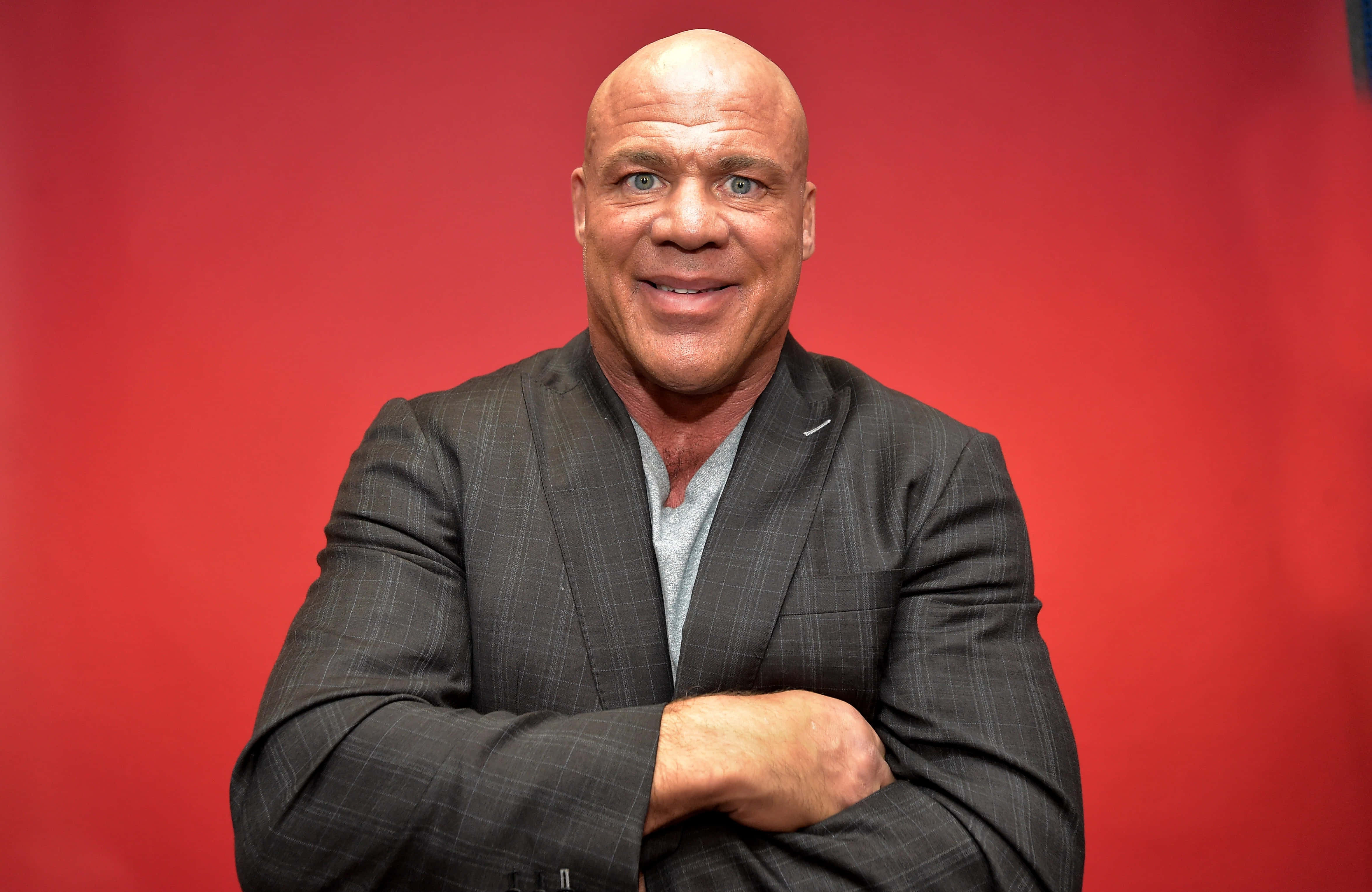 Kurt Angle, gray suit, solid red background, 4K Desktop Wallpaper