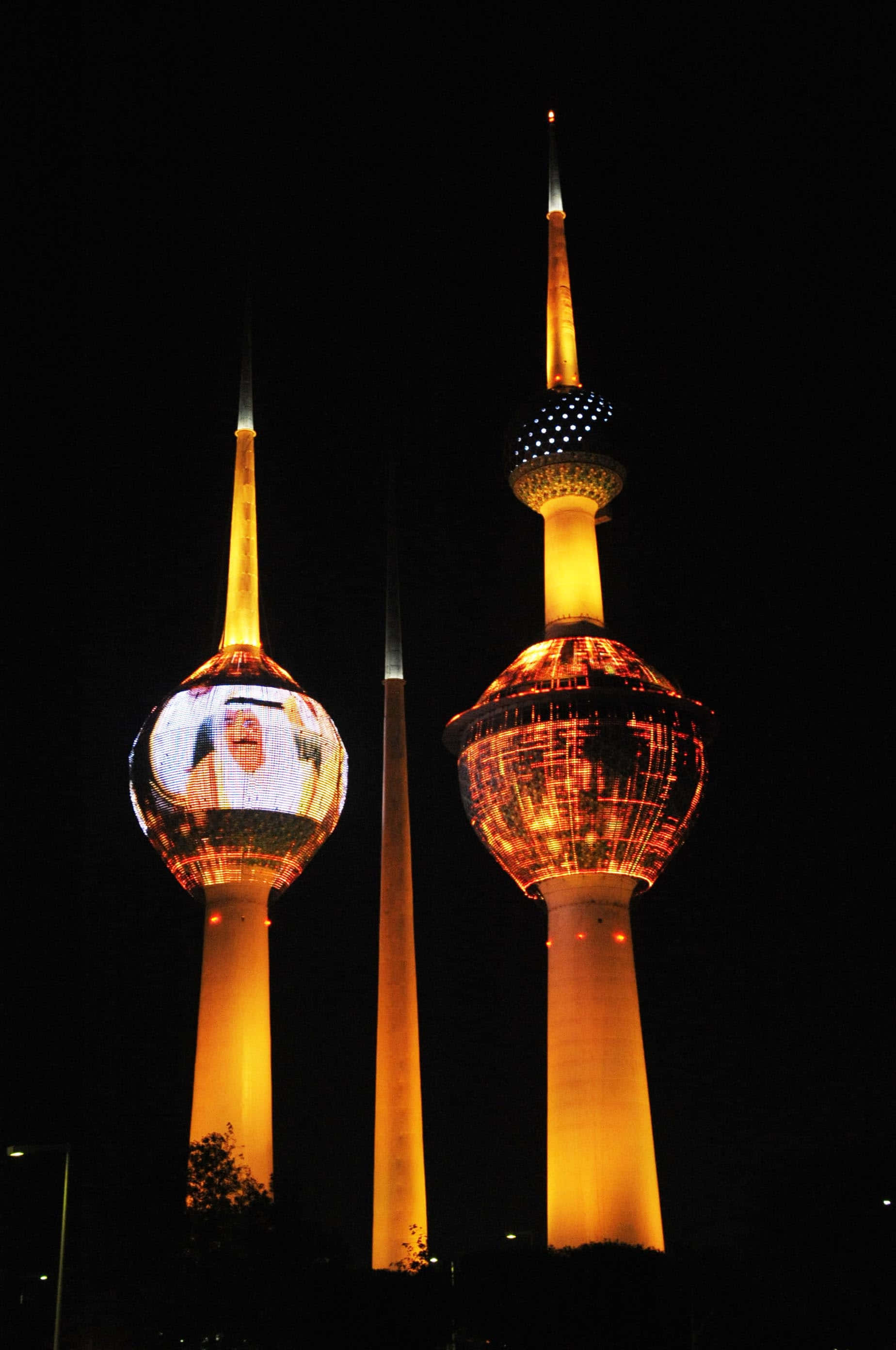 Kuwait Towers, black night sky, amber glow, 2K Phone Wallpaper