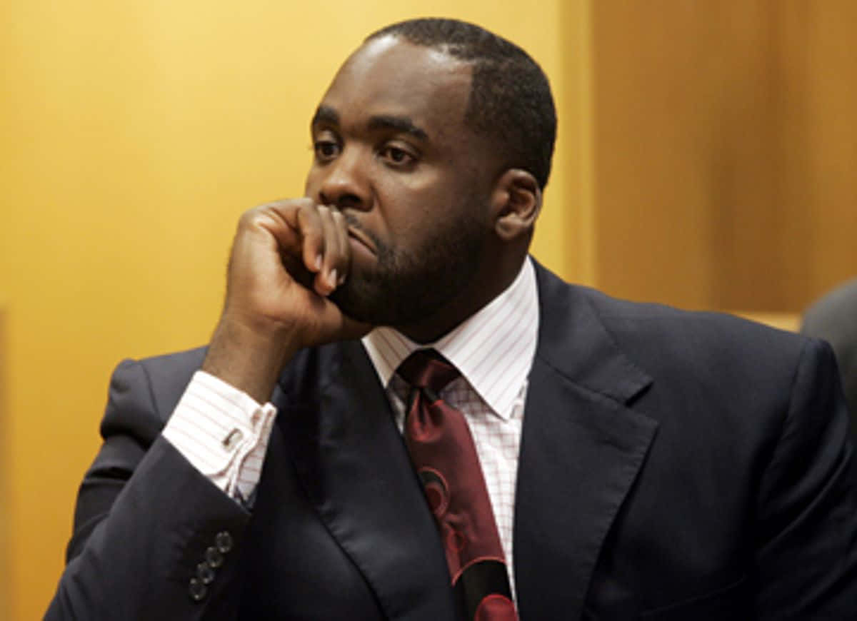 Kwame Kilpatrick, dark suit, red tie, SD Desktop Wallpaper