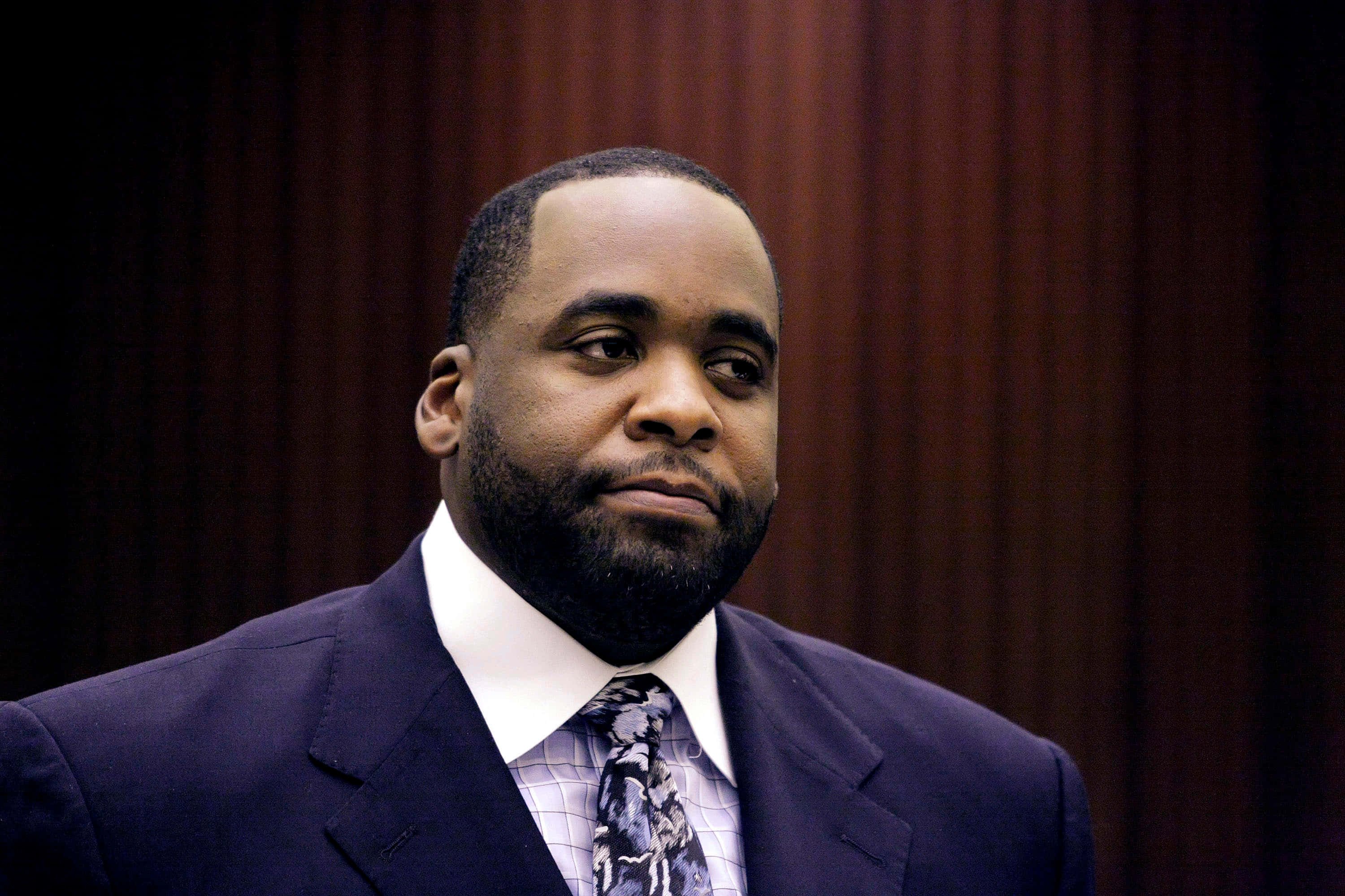 Kwame Kilpatrick, dark suit, patterned tie, 2K Desktop Wallpaper