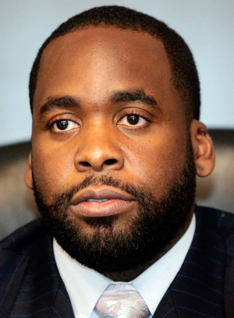 Kwame Kilpatrick, dark pinstripe suit, patterned tie, SD Phone Wallpaper
