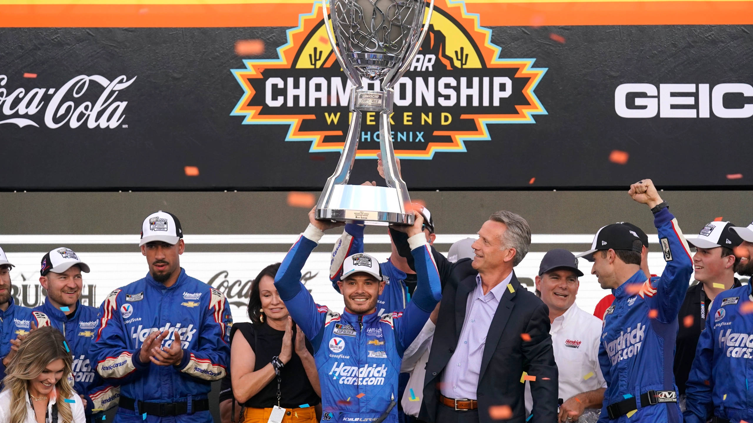 Kyle Larson, blue racing gear, silver trophy, 2K Desktop Wallpaper