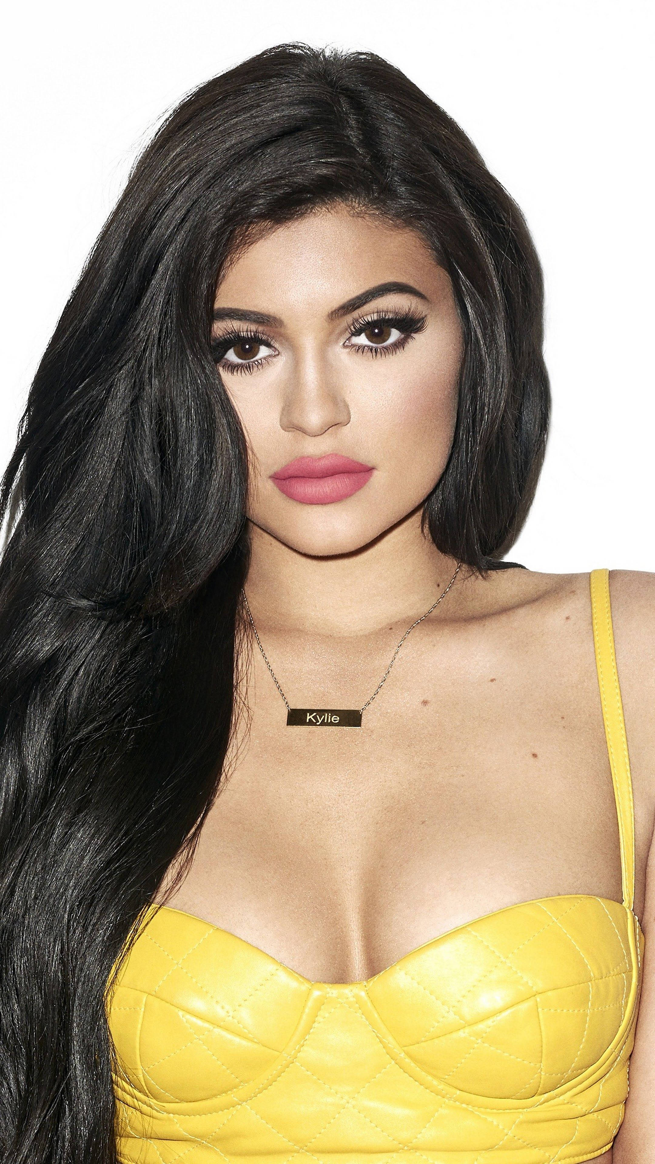 Kylie Jenner, yellow brassiere, bright yellow quilted top, 4K Phone Wallpaper