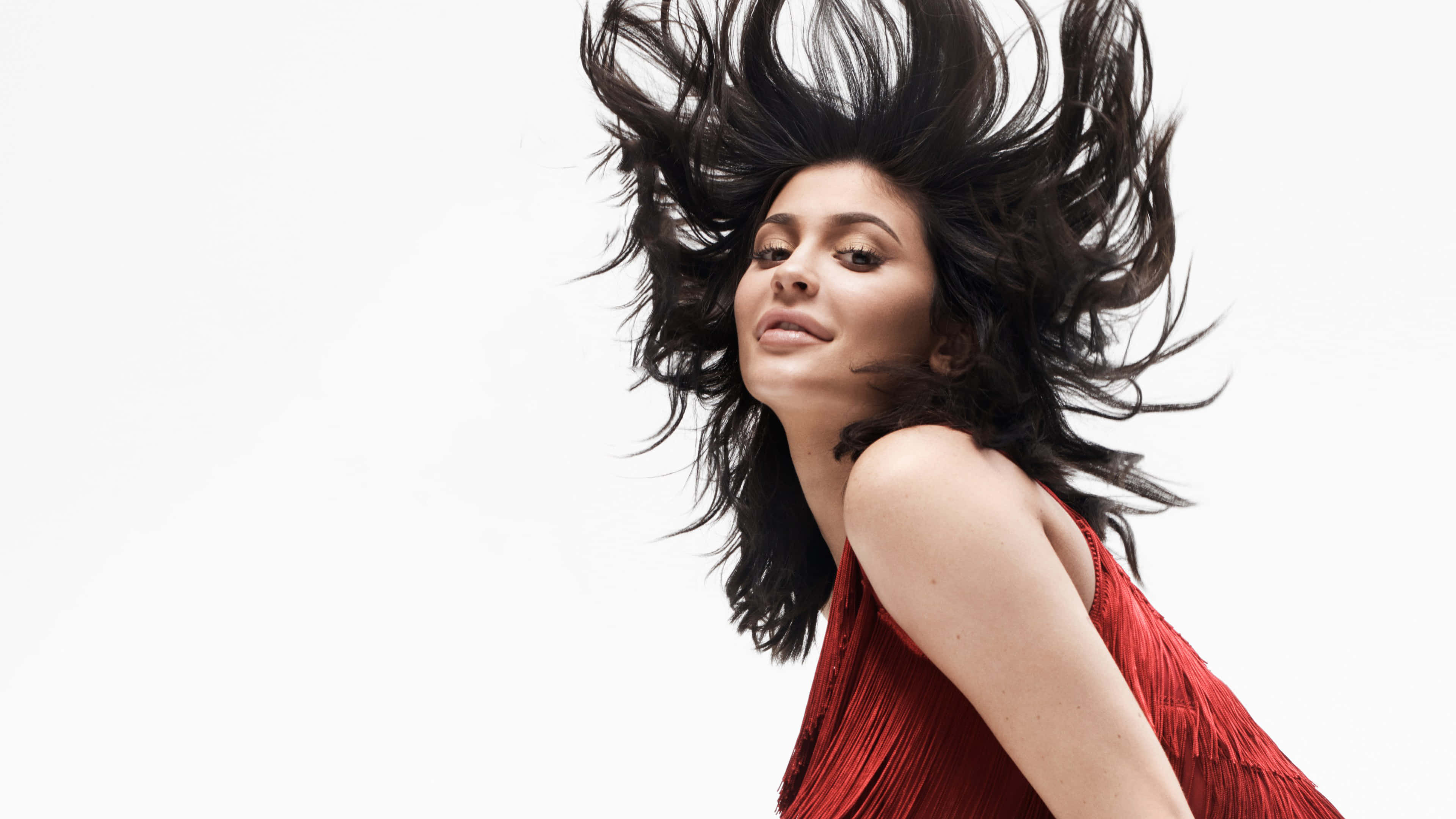 Kylie Jenner, red fringed dress, wild black hair, 4K Desktop Wallpaper