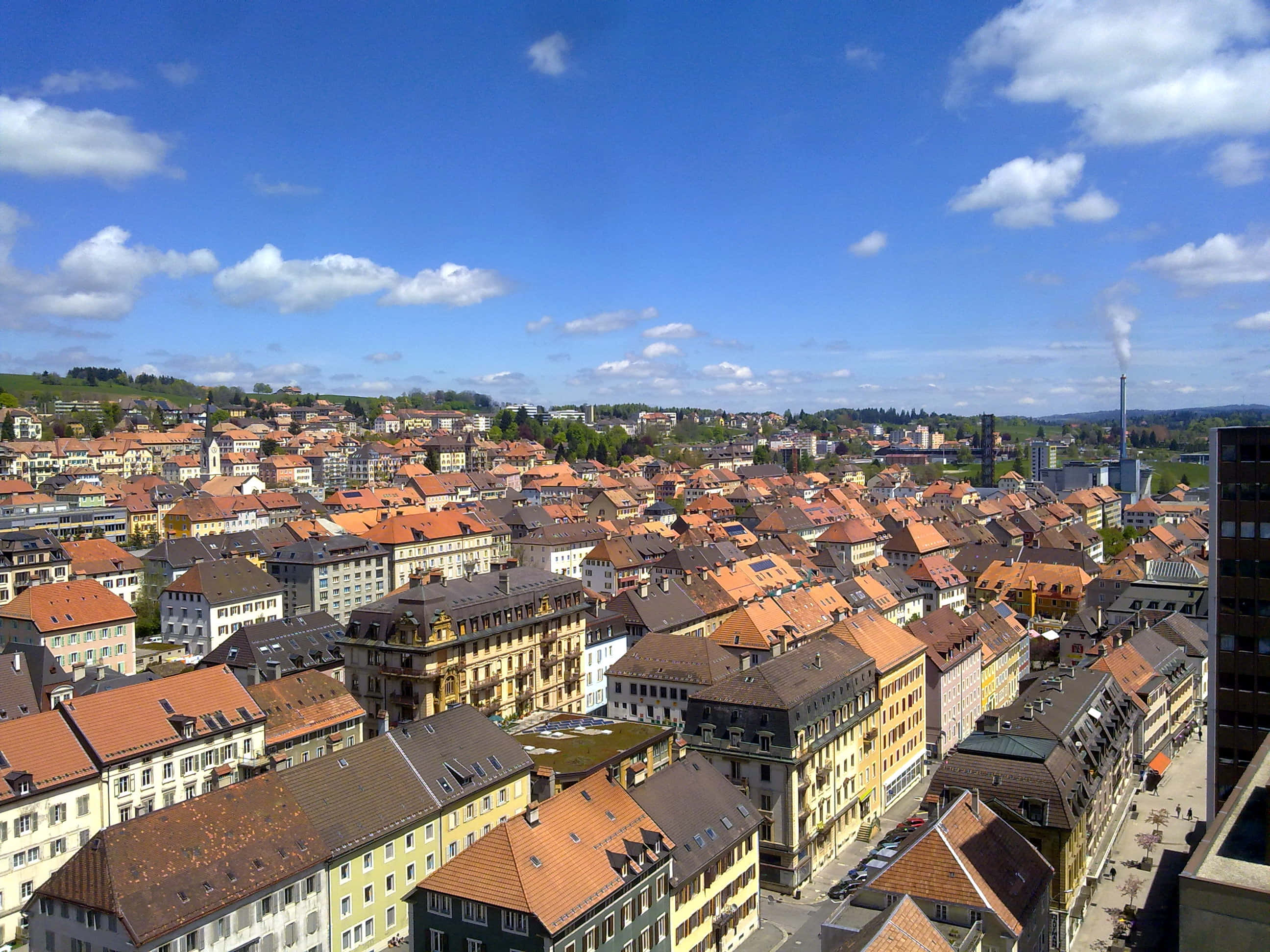 La Chaux De Fonds, terraco rooftops, pastel buildings, 2K Desktop Wallpaper