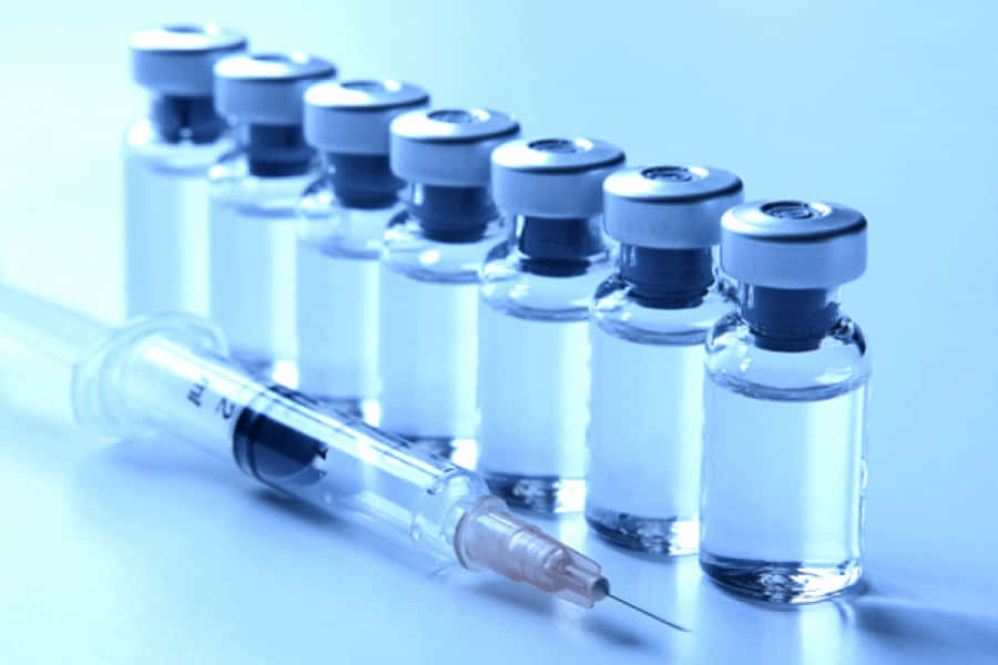 vaccine glass vials, syringe, cool blue lighting, SD Desktop Wallpaper