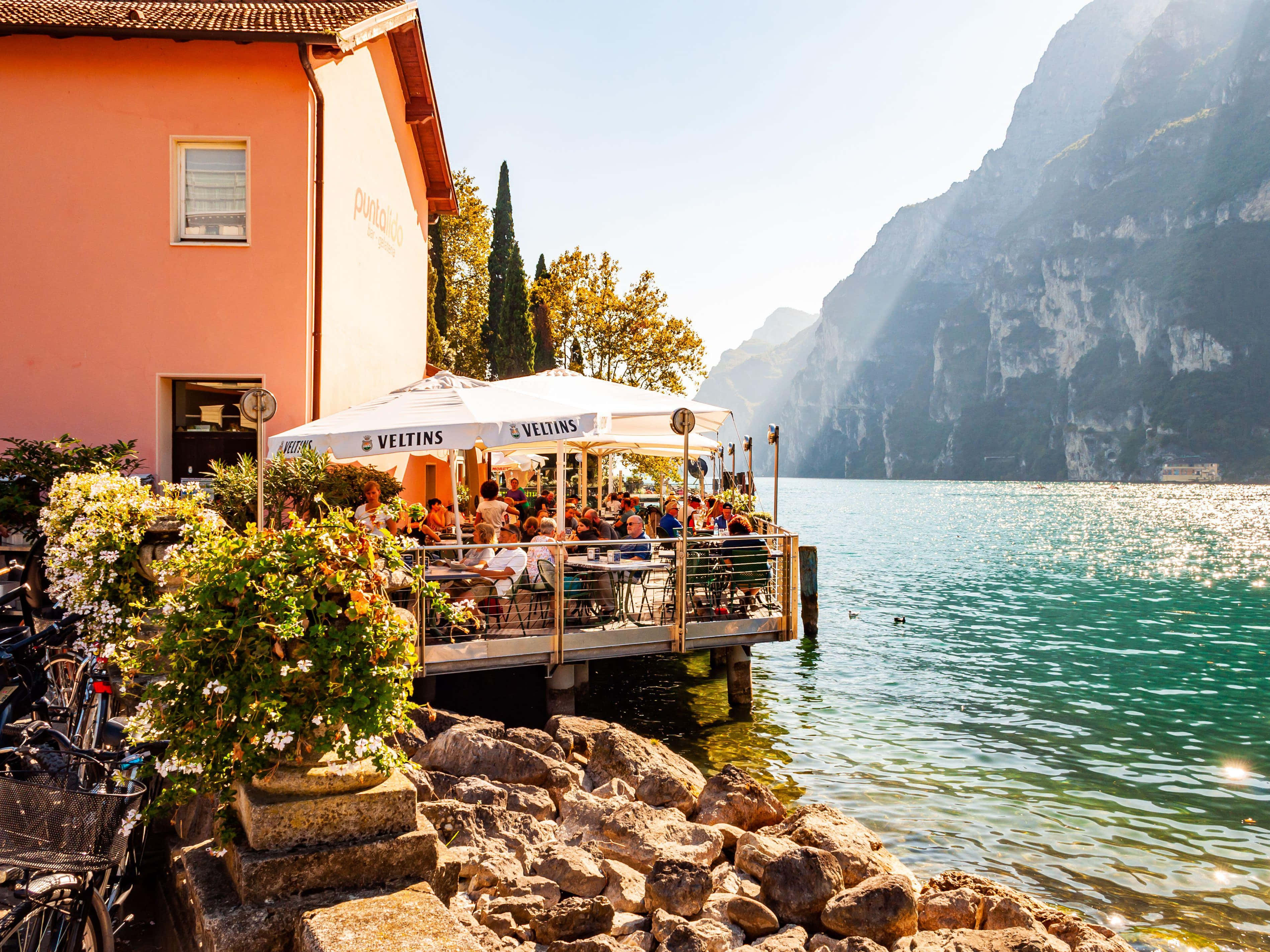Lago Di Garda, lake restaurant, rocky shore, 2K Desktop Wallpaper